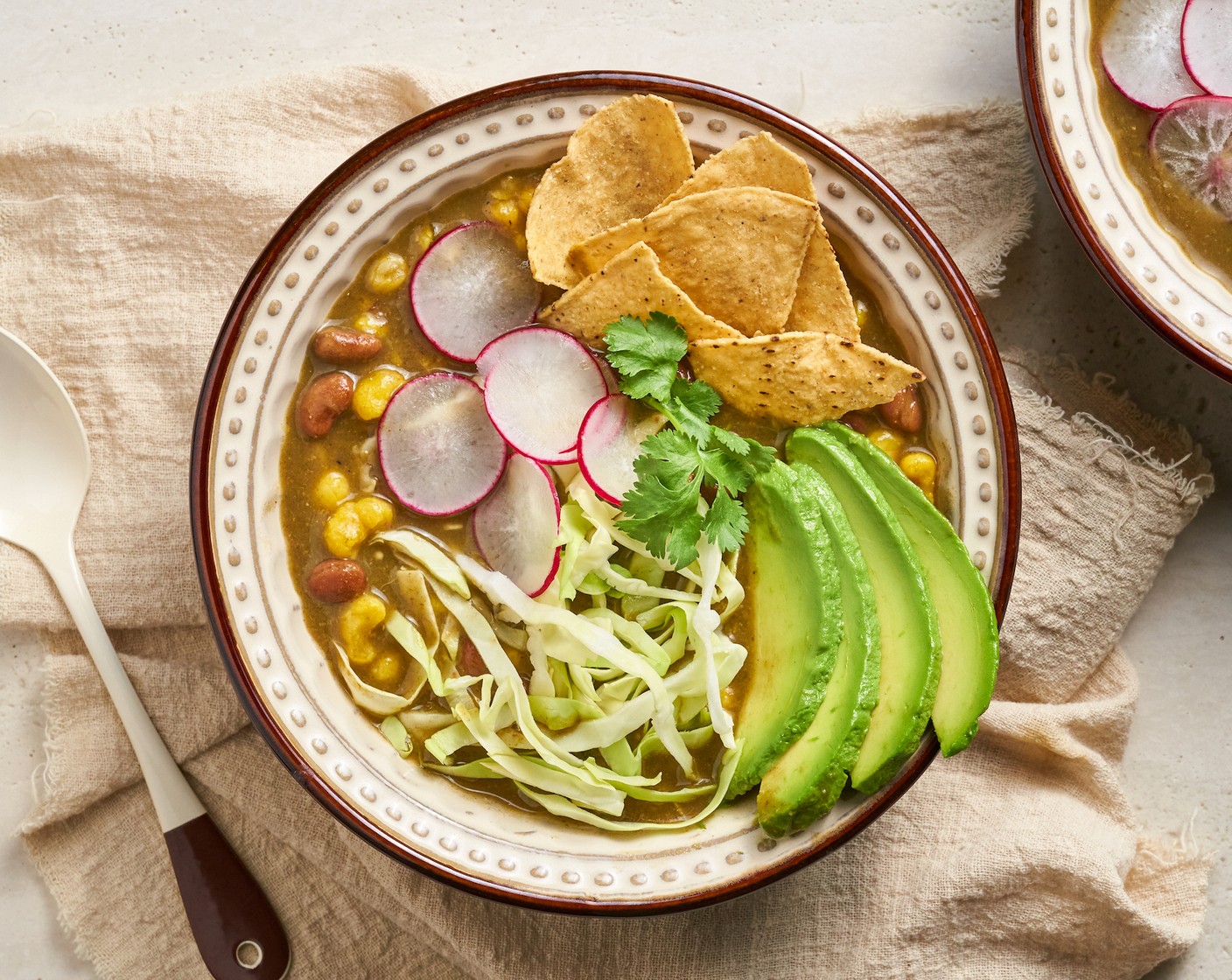 step 6 Transfer to a serving bowl and optionally top with Fresh Cilantro (to taste), Green Cabbage (to taste), Radishes (to taste), chopped onion, Avocados (to taste), Lime Wedges (to taste), and Tortilla Chips (to taste). Enjoy it warm!