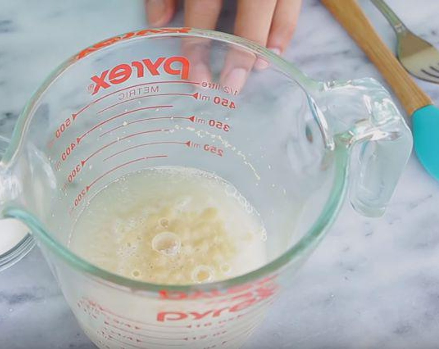 step 1 In a container, mix the Water (2/3 cup), Active Dry Yeast (1 tsp), and Granulated Sugar (1 Tbsp). Mix and let sit for 10 minutes.