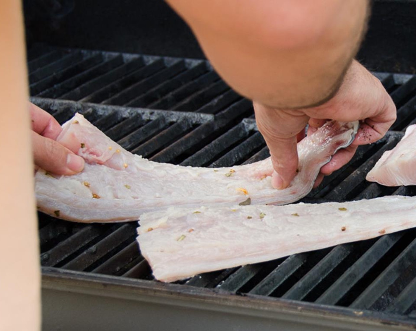 step 3 Add the Skin-on Kingfish Fillets (1.5 lb), skin side down to the opposite side of the grill that doesn't have the heat on.