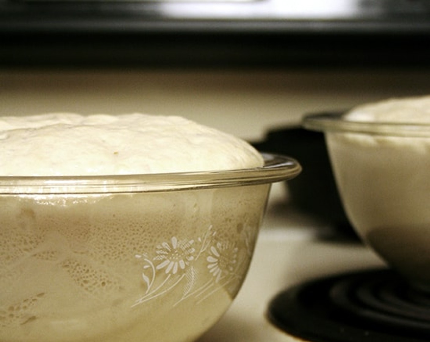 step 8 Let the dough rise for about 20-30 minutes on the countertop near the oven, or near a warm spot, until it has risen to just below or above the top of the bowls.