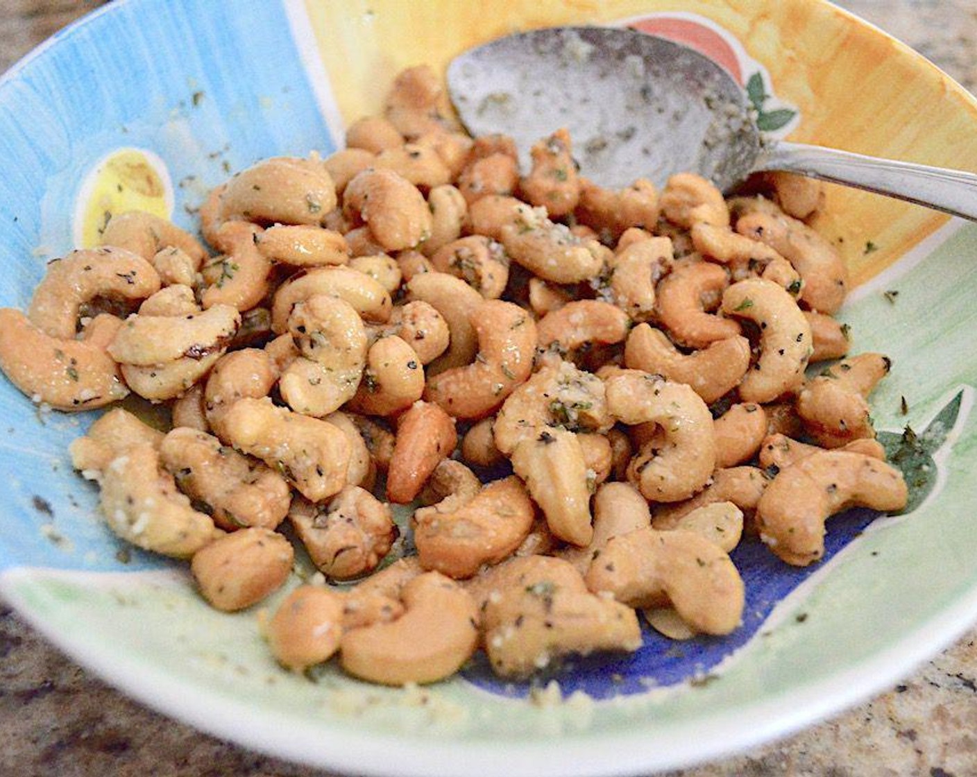 step 2 Line a sheet tray with a silicone mat. Combine the Cashew Nuts (1 cup), Olive Oil (2 Tbsp), Grated Parmesan Cheese (1 Tbsp), Dried Parsley (1/2 tsp), Dried Basil (1/2 tsp) and Dried Tarragon (1/2 tsp) in a bowl and stir it all together well to make sure the cashews are coated.