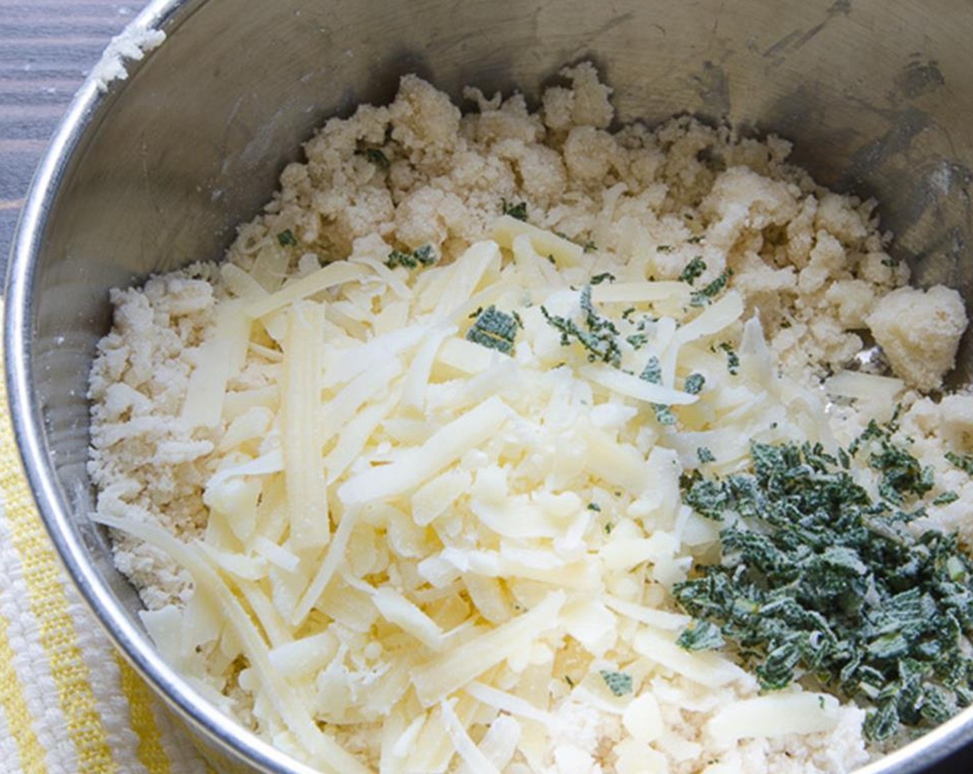 step 3 Grate the Parmesan Cheese (1/4 cup). Mince the Sage Leaves (4).  Add the parmesan and sage and toss to combine. Set aside.