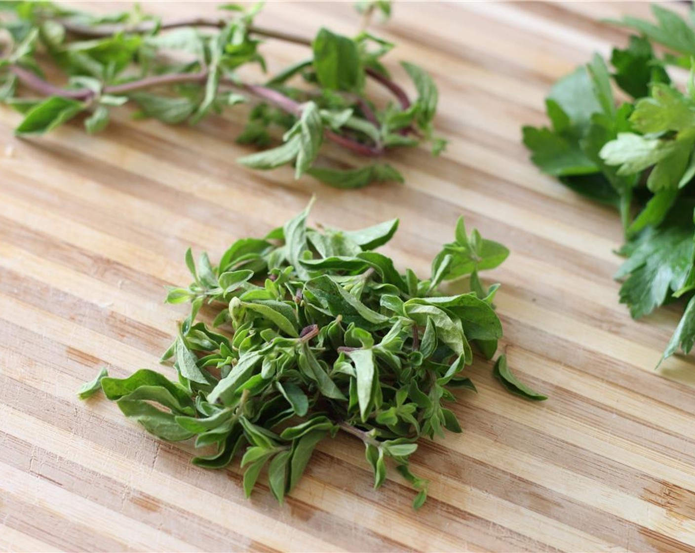 step 2 Pull the leaves from the stems of the Fresh Parsley (2 Tbsp) and Fresh Oregano (1 Tbsp).