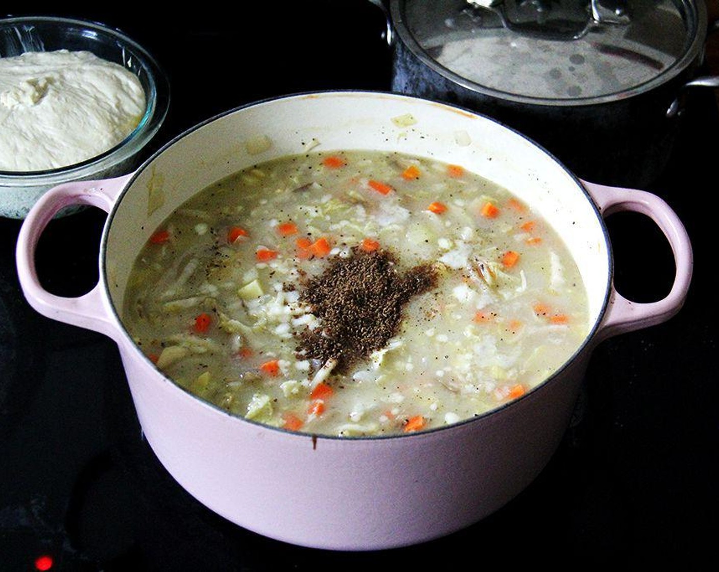 step 4 When the mixture simmers, add the cabbage, Carrots (2 cups), Potatoes (2 cups), Kosher Salt (2 tsp), Freshly Ground Black Pepper (to taste), Caraway Seeds (2 tsp), White Balsamic Vinegar (4 Tbsp) and Granulated Sugar (1 tsp). Simmer, stirring every so often, for about about 30 minutes.