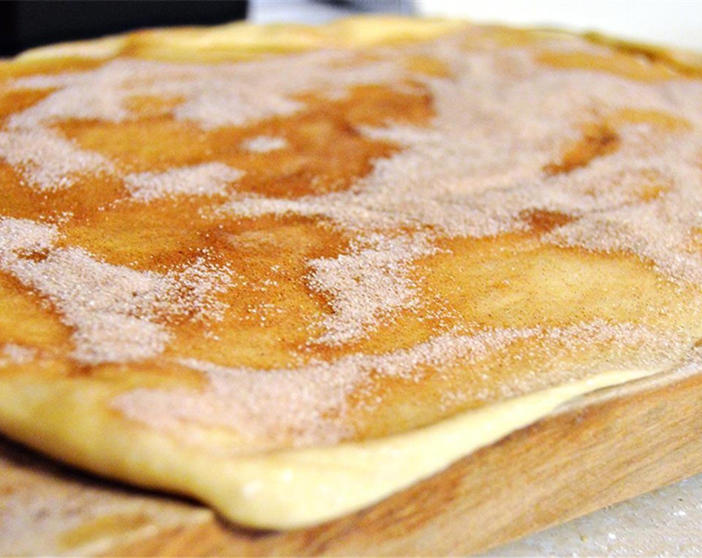 step 3 Turn dough out onto floured surface and roll into rectangle. Spread Butter (1/4 cup) over rectangle. Mix together Ground Cinnamon (1 Tbsp) and Granulated Sugar (1/2 cup). Sprinkle over dough.