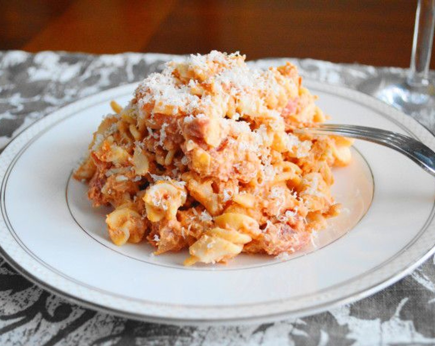 step 9 Take the pan off of the heat and scoop the pasta into bowls. Top with the Parmesan Cheese (to taste) and serve!