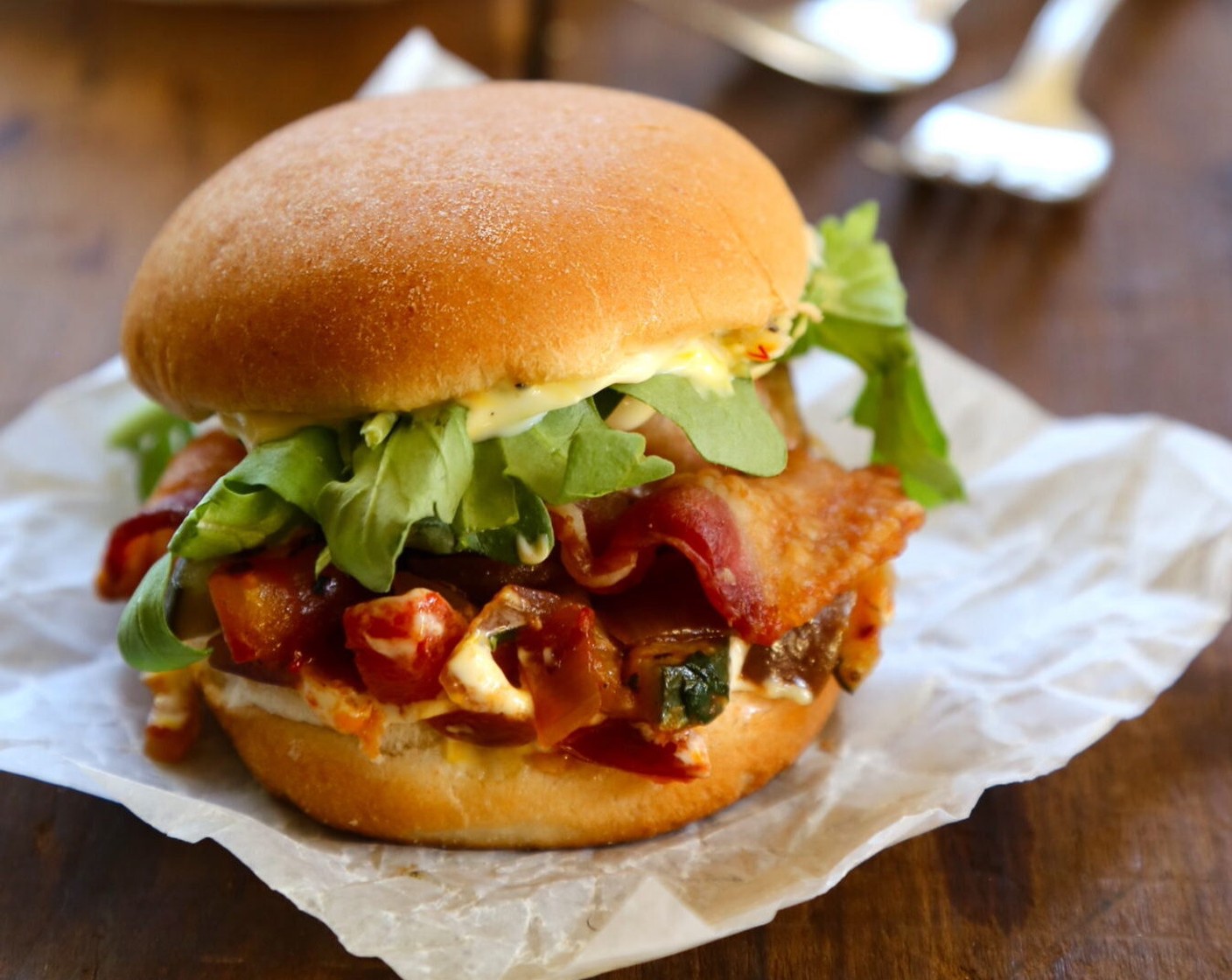 step 9 Top with Arugula (3 cups) and more lemon saffron ailoi. Top with bun and enjoy!