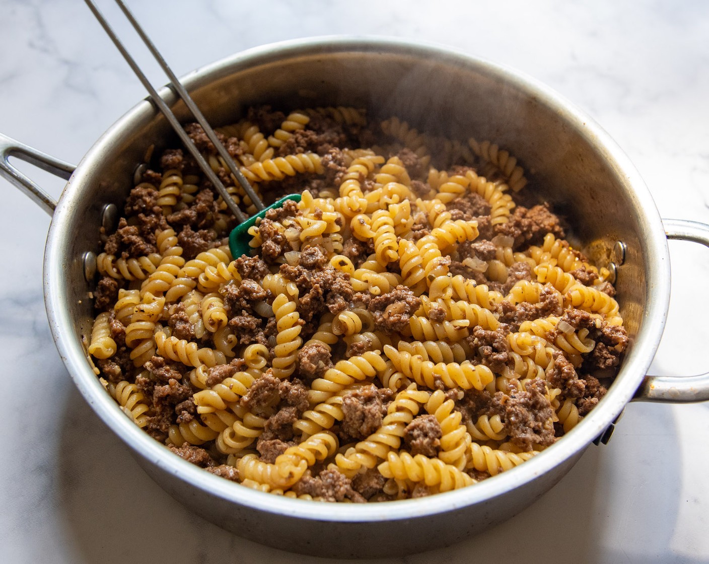 step 3 Stir in the Rotini Pasta (8 oz). Lower heat, cover, and gently simmer for 10-12, stirring 2-3 times. Cook until the pasta is al dente and the broth has been absorbed. If the broth has been absorbed, but the pasta is still not tender, add 2-4 Tbsp of water, stir, and cook a few minutes longer.