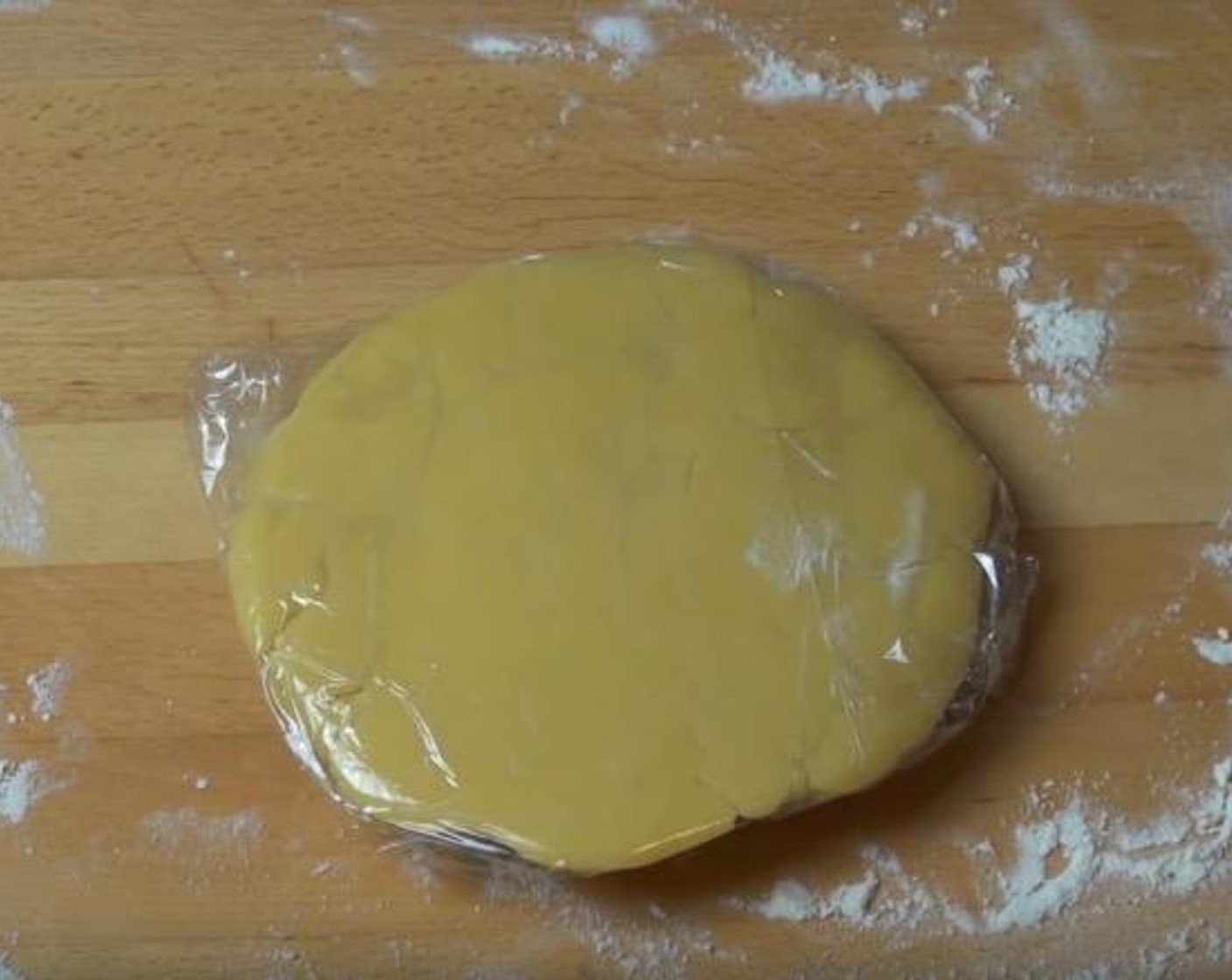 step 3 Transfer the dough to a lightly floured surface. Knead until smooth and slightly elastic. Shape dough into a disk and cover in plastic wrap. Place in refrigerator for 30 minutes to chill.