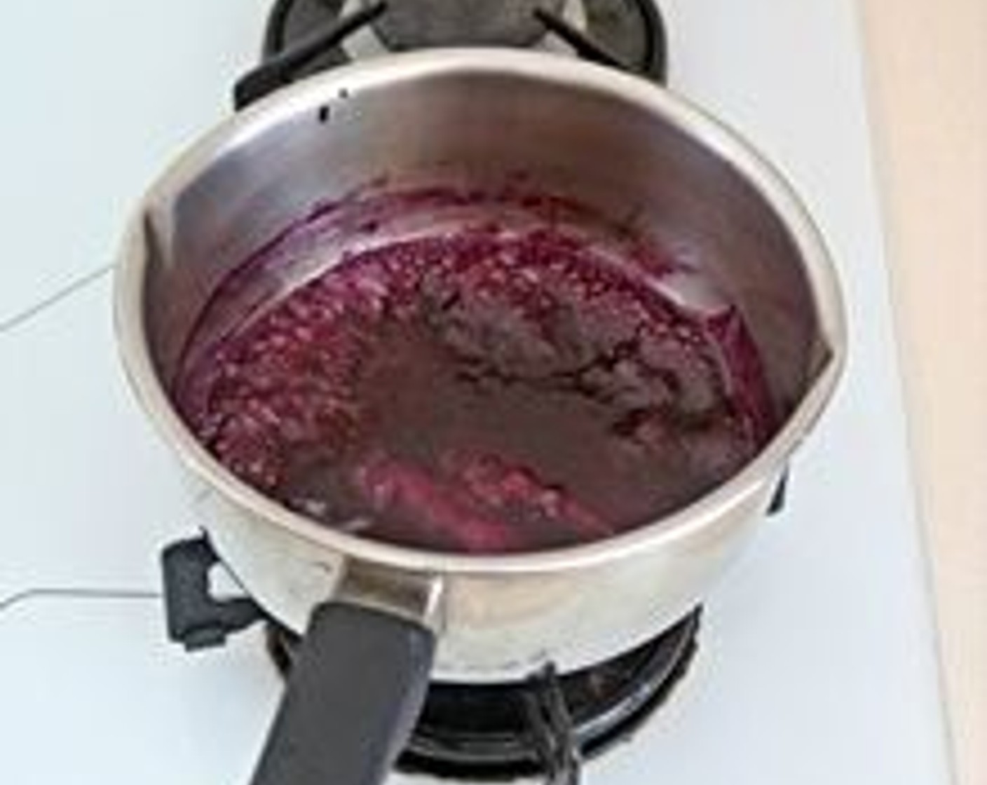 step 13 Return the blueberry liquid to the pot and lightly boil the liquid together with the soaked gelatin. Stir till gelatin melted, off the heat and add juice from Lemon (1) stir well again and leave the blueberry liquid mixture to cool.