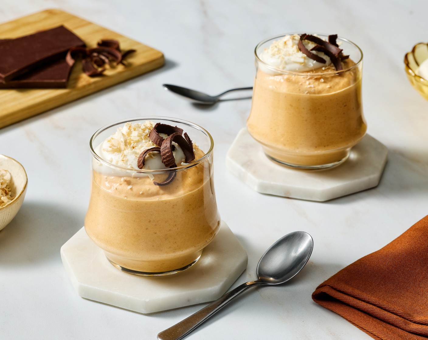 step 6 Top each mousse with a dollop of coconut whipped cream and garnish with Toasted Coconut Flakes (30 g) (if using) and Dark Chocolate Curls (1 bar). Serve and enjoy!