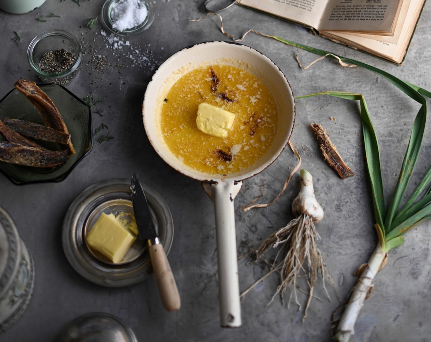 step 2 Melt the Butter (3/4 cup) in a saucepan until foaming and add in the Garlic (2 cloves), Lemon (1), Mullet Fillet (1 Tbsp), and Fresh Rosemary (1 sprig). Stir to combine.