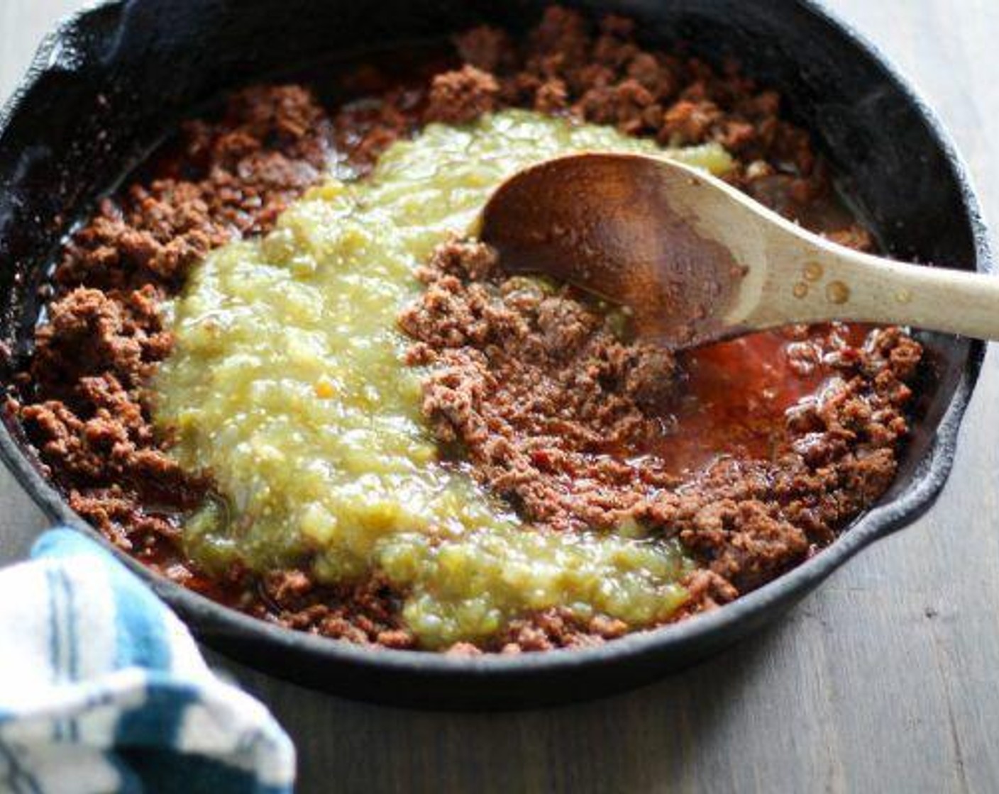 step 2 Cook Lean Ground Beef (1 lb) and Mexican Chorizo (8 oz) until browned. Stir in Salsa Verde (8 fl oz) and Water (1/2 cup). Simmer for 10 minutes.