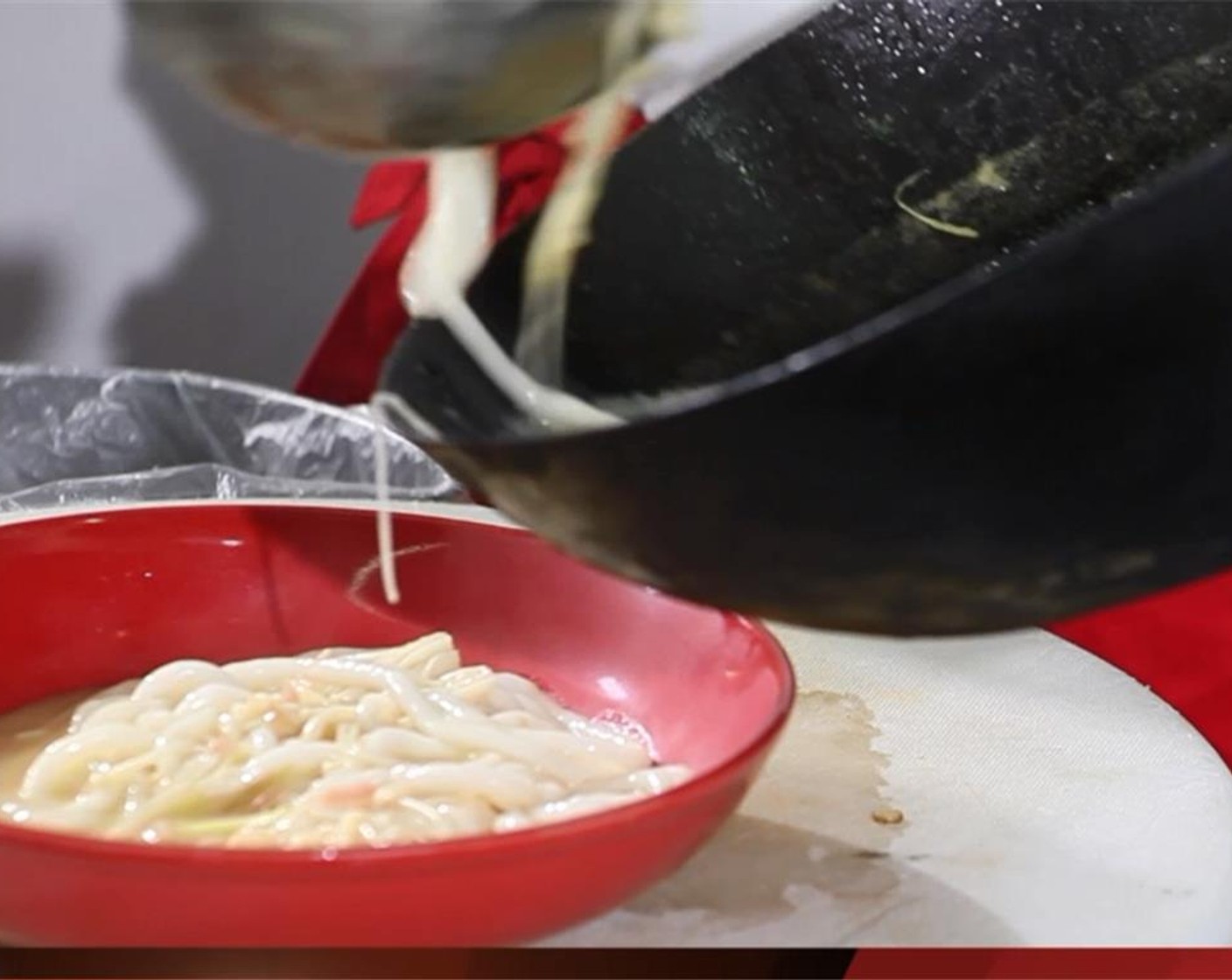 step 7 Pour the broth into the bowl over the mushrooms and noodles.