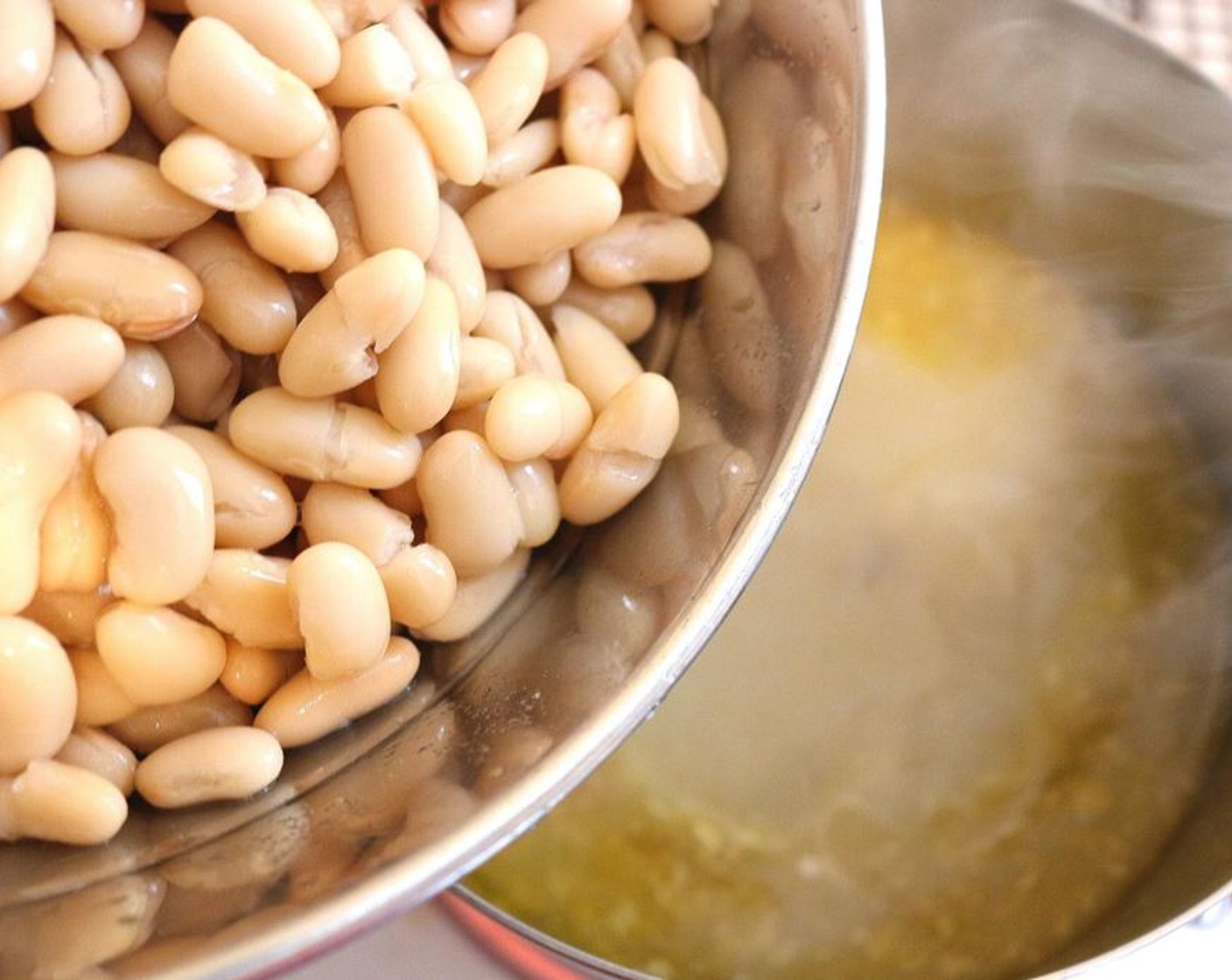 step 2 At this point, you should have about 1 qt porkstock left; add Canned Cannellini White Kidney Beans (1 cup) to the pork stock.