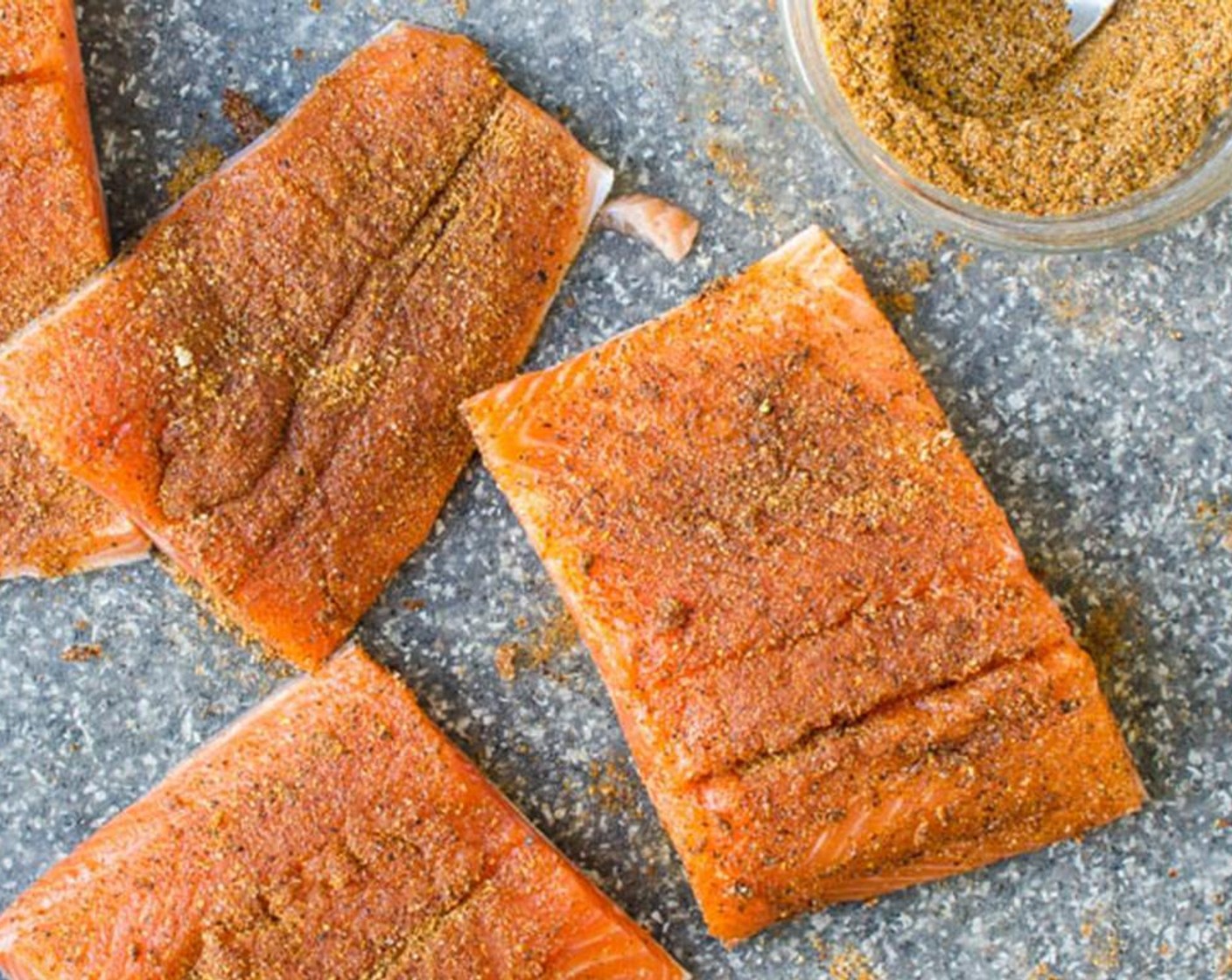 step 6 Sprinkle the spice rub over the flesh of the fish and use your fingers to pat and rub it in. Set aside.