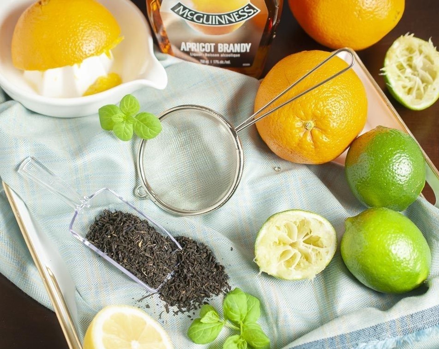 step 2 Strain rum and add to a small pitcher. Add Oranges (2), Apricot Brandy (4 Tbsp), juice from Limes (1 1/4) and juice from Lemon (1), Honey (1 tsp), and Bitters (4 dashes) and stir to combine.
