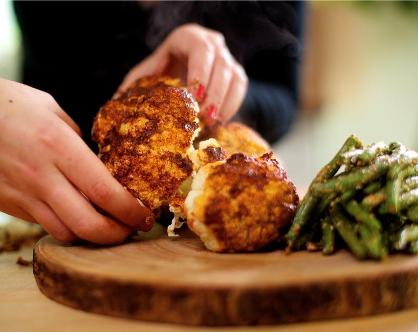 step 11 Serve this dish family style by placing the cauliflower on a large platter. Sprinkle the Fresh Chives (6 stalks) on top. Portion the cauliflower by using a fork and separating the florets into large pieces where they naturally break. Arrange the green beans to one side.