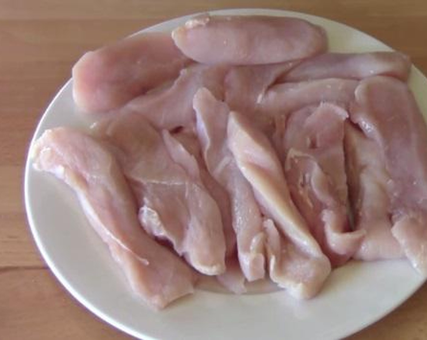 step 2 Cut the Chicken Breasts (3) into strips.