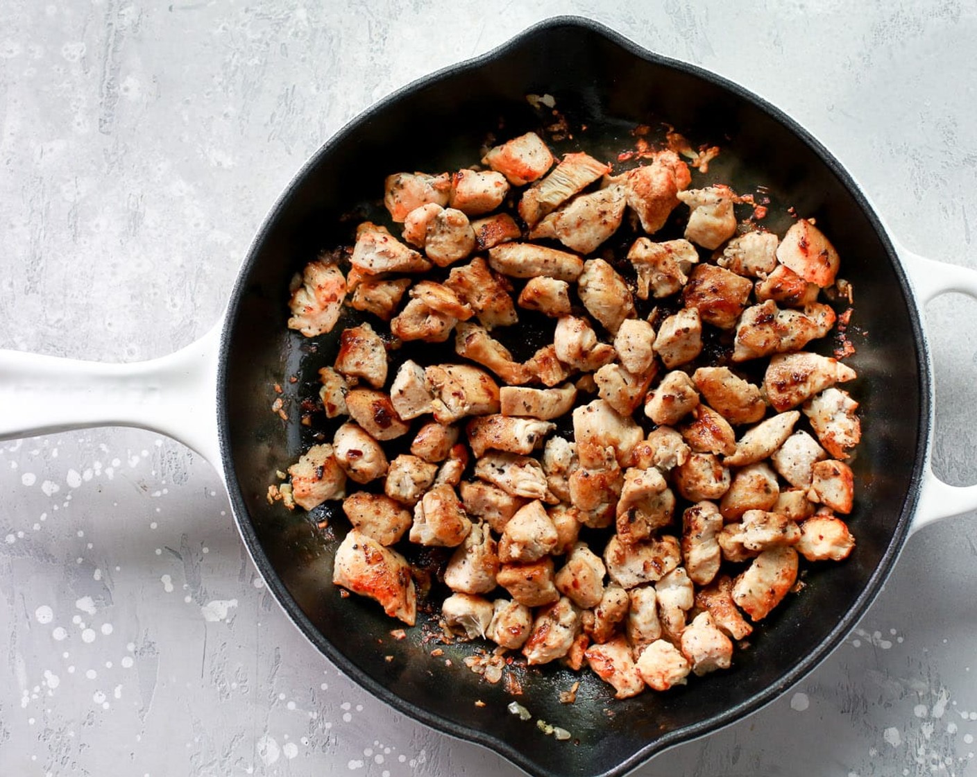 step 2 In a skillet over medium heat, add Olive Oil (1 Tbsp), Garlic (3 cloves), and chicken. Sauté the chicken for about 7-10 minutes or until it is cooked through. Don’t forget to stir well. Set the chicken mixture aside.