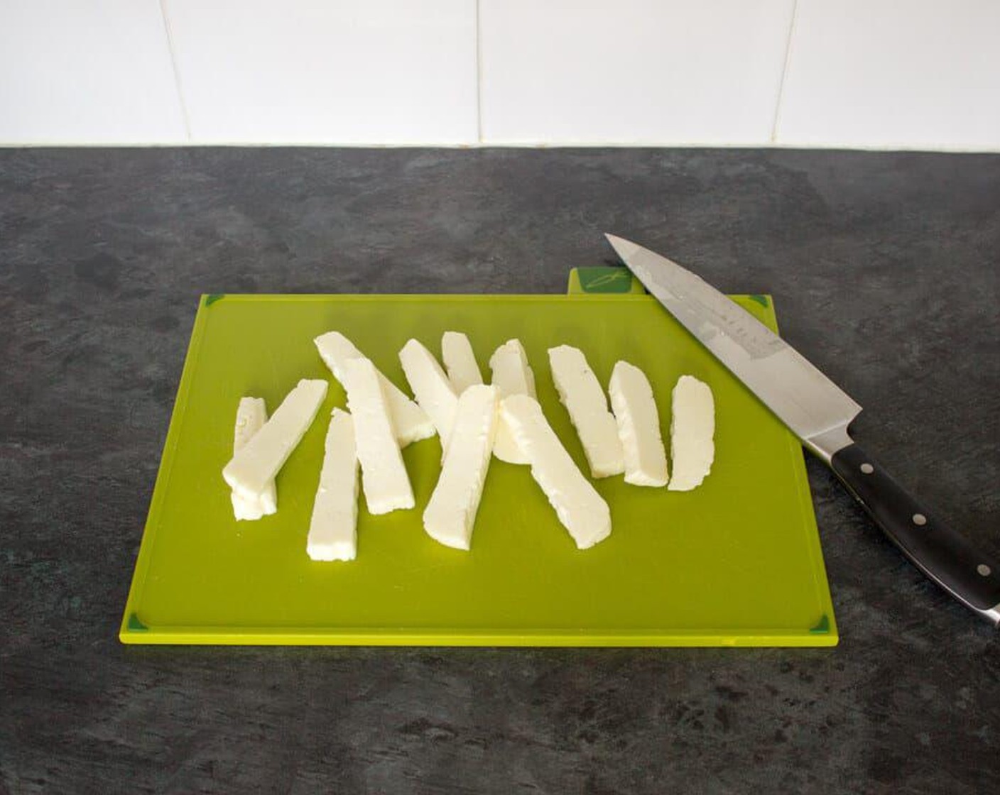 step 2 Next, open your packet of halloumi, rinse it under cold water and dry off with a paper towel. Then cut Halloumi Cheese (8 oz) into chunky fries using a sharp knife.