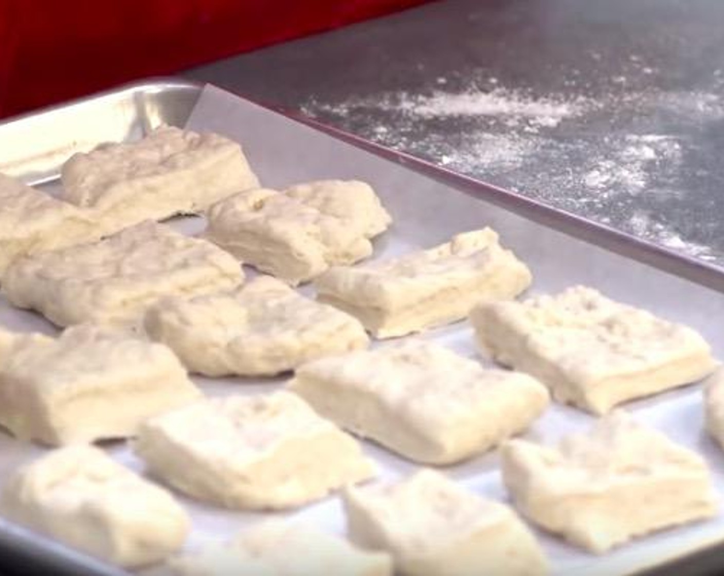 step 3 Transfer the squares to a cookie sheet lined with some non-stick baking paper and leave a little bit of space in between. Preheat the oven to 220 degrees C (425 degrees F), and put it in for about 10 to 12 minutes.