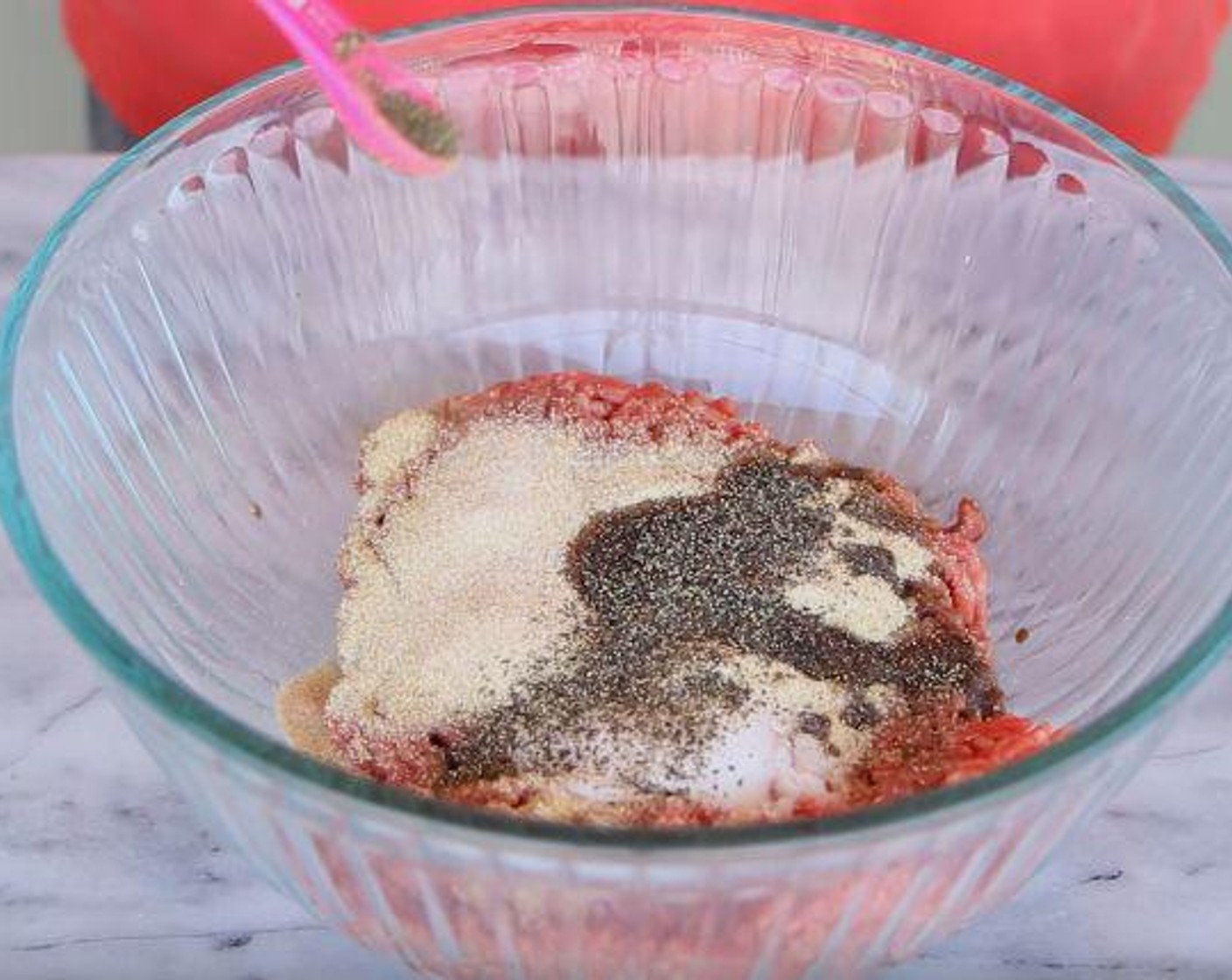 step 2 In a large bowl, add Simply Organic Garlic Powder (2 tsp), Simply Organic Onion Powder (2 tsp), Worcestershire Sauce (1 tsp), Salt (1 tsp), Ground Black Pepper (1/4 tsp) to the Ground Beef (1 lb). Mix with your hands, being careful not to over mix.