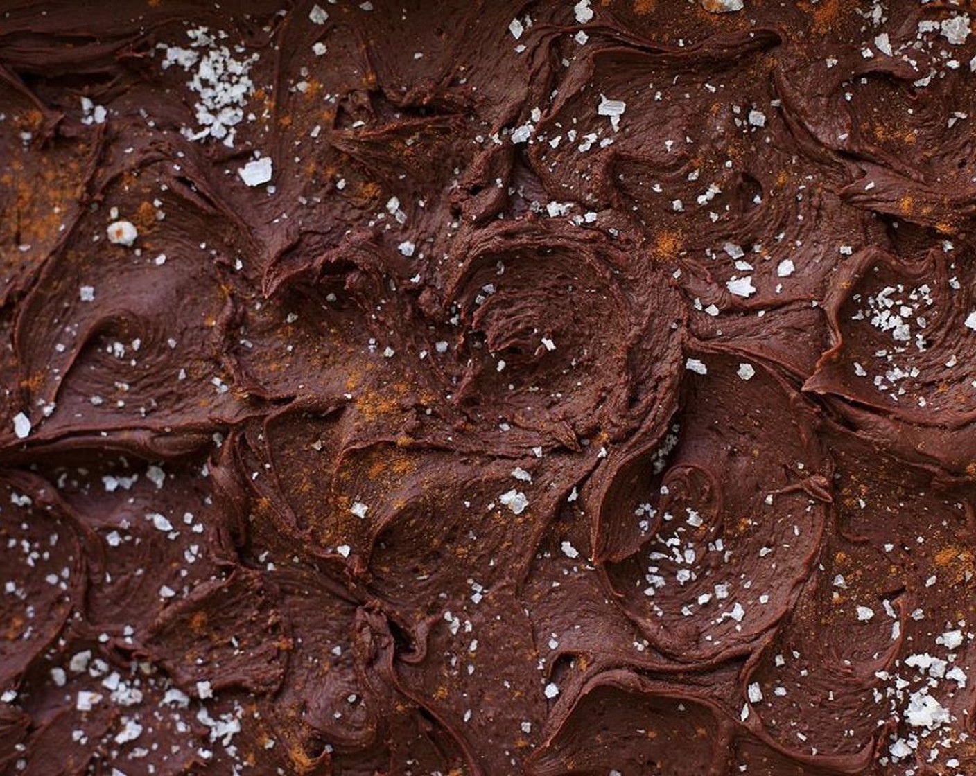 step 9 Pour the fudge over the brownies. The brownies can still be warm but not hot. Smooth with the back of a spoon and make swirls.
