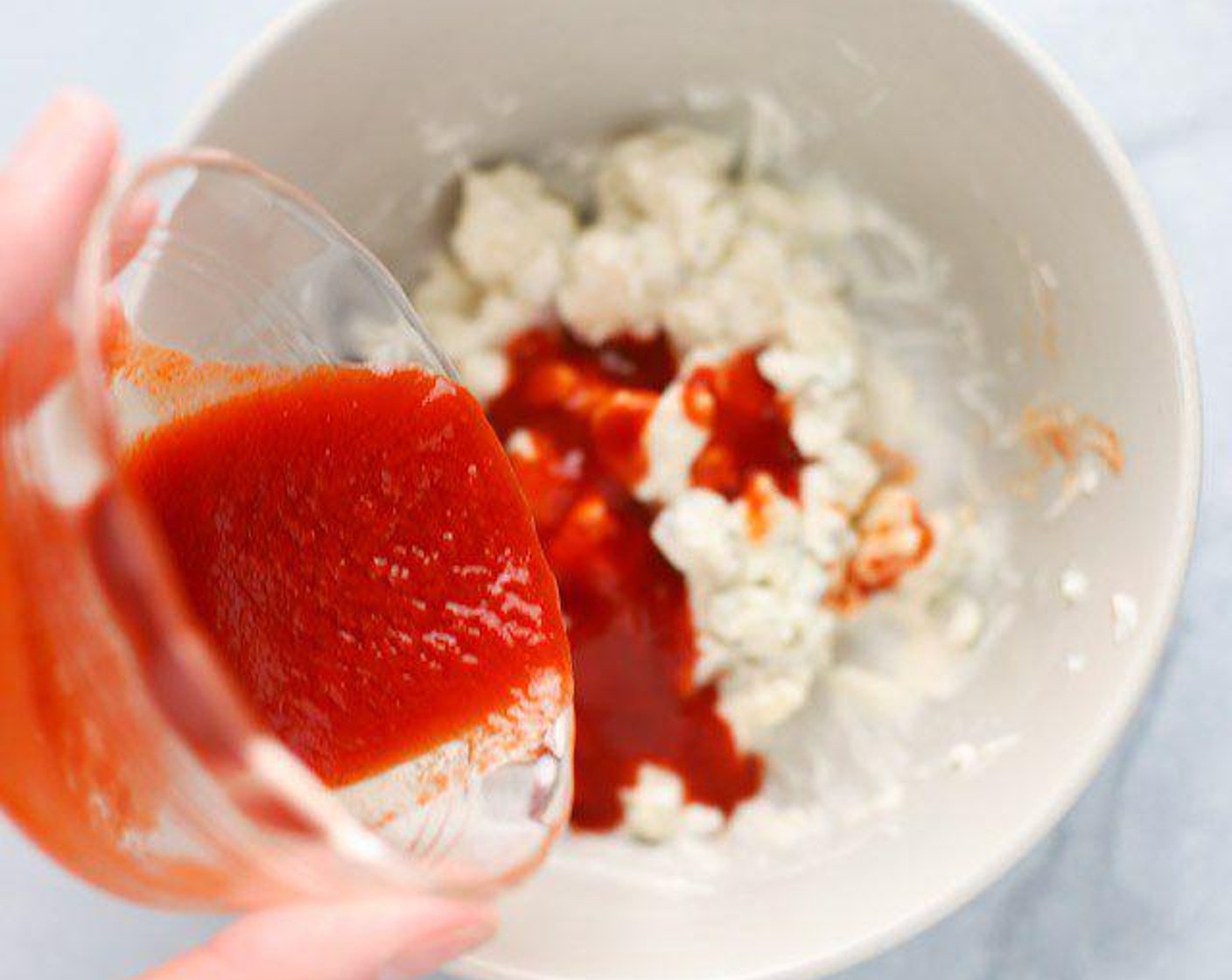 step 1 Mix the Blue Cheese (1/4 cup), Mayonnaise (2 Tbsp) and Buffalo Sauce (2 Tbsp) in a small bowl. Buffalo sauce and mayonnaise don't always combine together easily. The trick is to slowly add the buffalo sauce and incorporate a little at a time to the other ingredients. Mix until consistent in color.