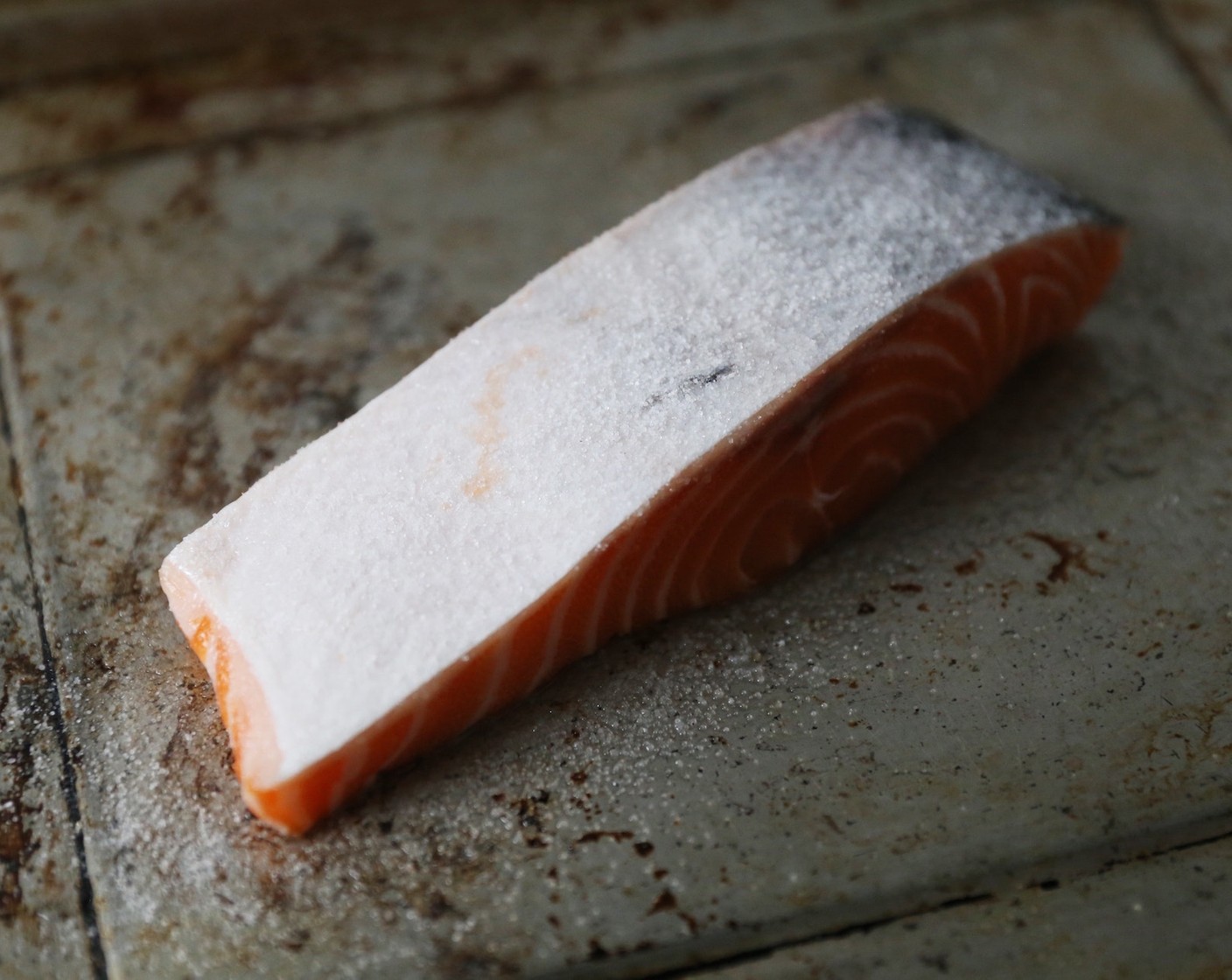 step 3 Flip the salmon over and generously salt the skin with the remaining Kosher Salt (1/2 tsp).