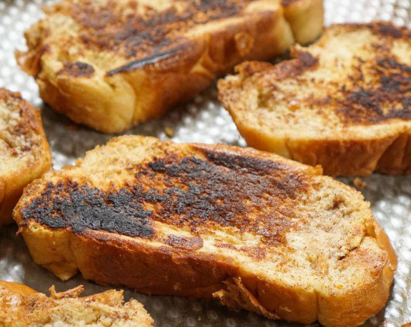 step 6 Heat a large skillet or a large griddle to medium heat. Melt Butter (3 Tbsp) evenly coating the skillet. Add the slices and fry 2-3 minutes on each side until golden brown. Repeat until all bread slices are cooked.