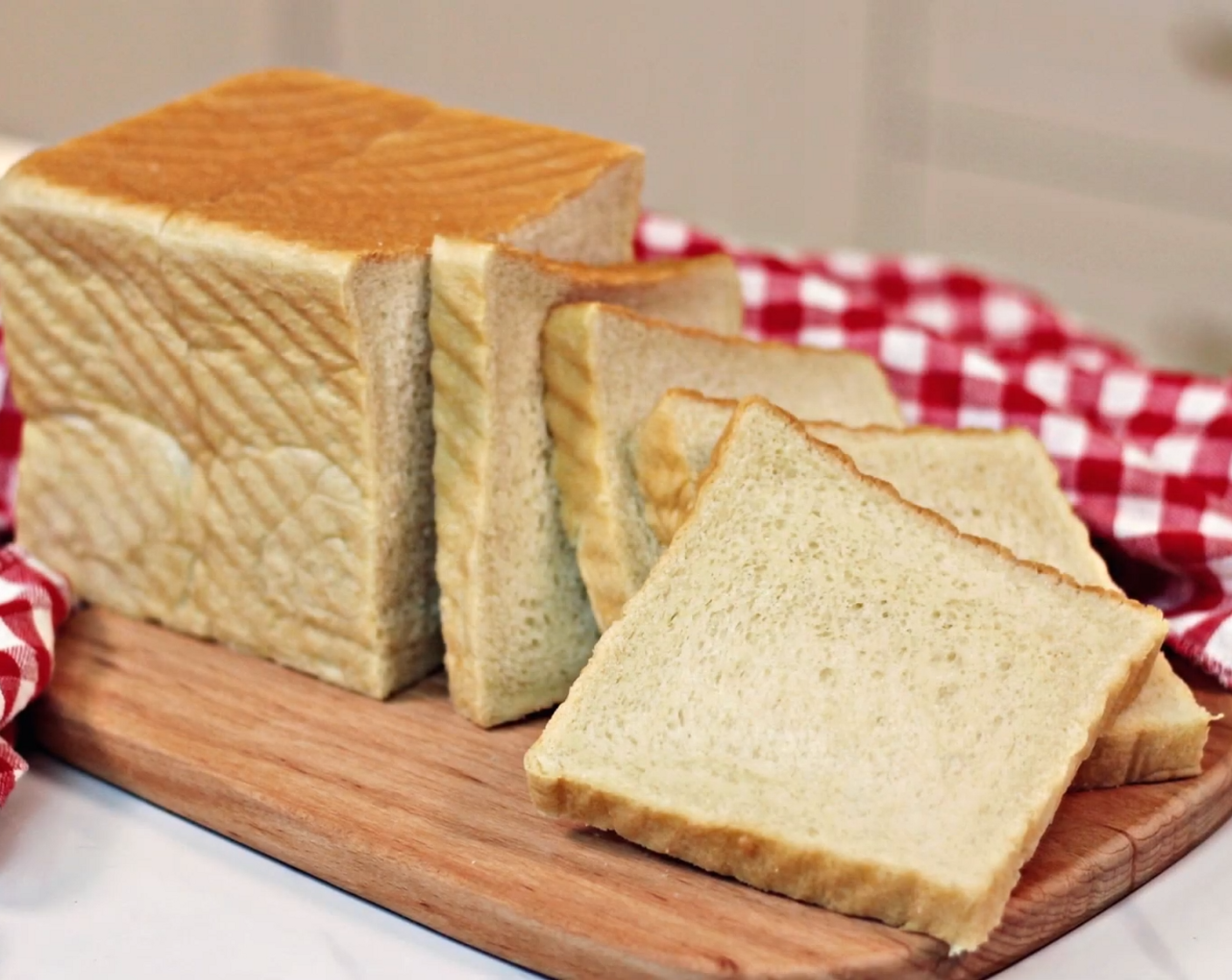step 10 Once it is fully cooled, use a bread knife or an electric knife to slice the bread neatly in an orderly manner. Then wrap it up with a plastic wrap to store the bread.