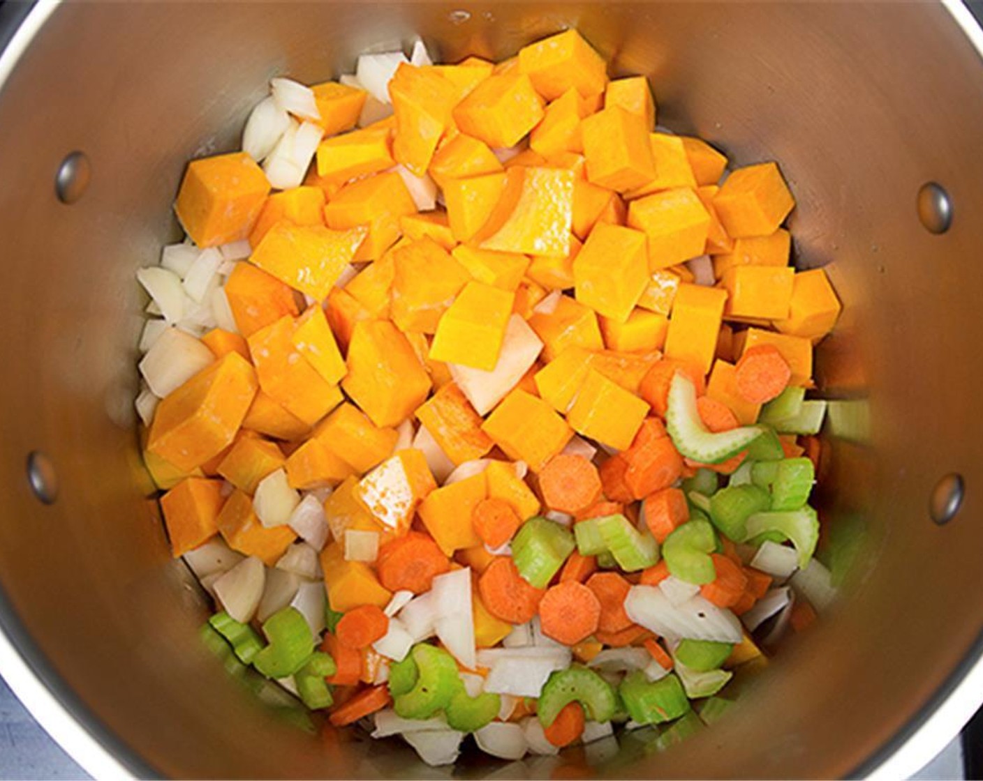 step 2 Cook the Onion (1), Celery (1 stalk), Carrot (1), Squash (1) and Potatoes (2) for 5 minutes, or until lightly browned.