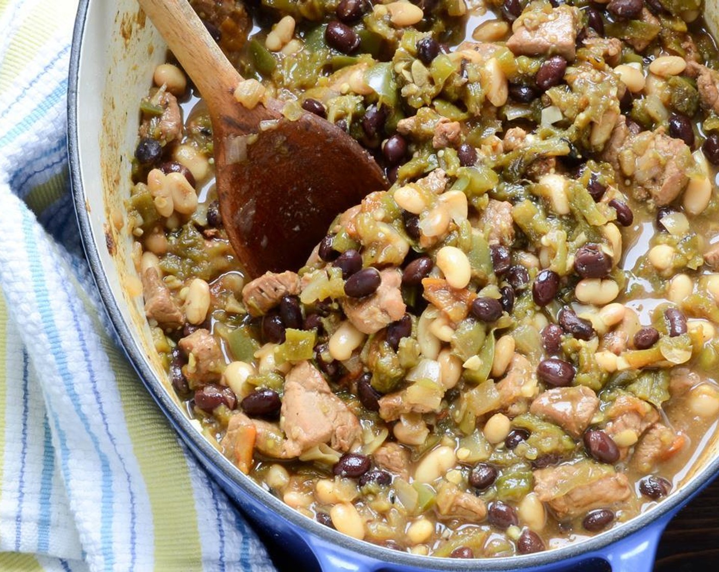 step 8 Turn the heat to high and bring to a boil, reduce heat to a simmer and stir in the Canned Black Beans (2 1/3 cups) and Canned Great Northern Beans (2 1/3 cups). Simmer for 30 minutes with the lid slightly askew, stirring occasionally.