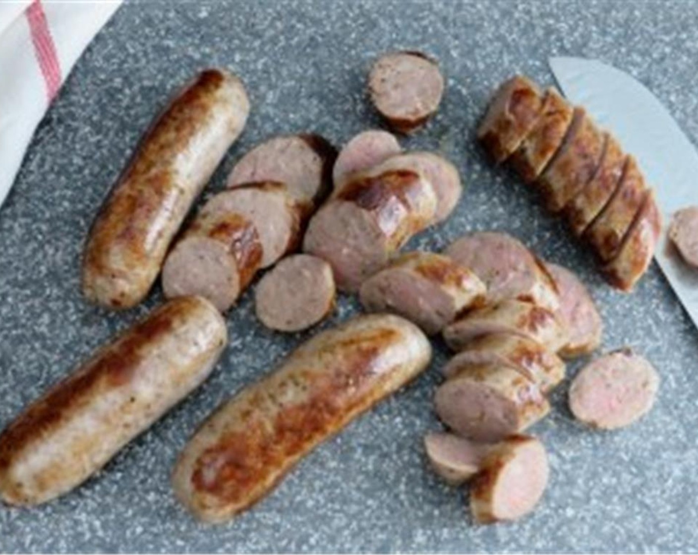 step 6 Remove Italian sausages to a cutting board. Slice them on the diagonal about 1/2" thick and set aside.