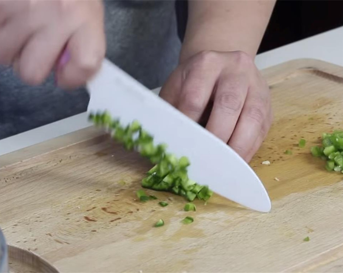 step 2 Finely dice seeded Jalapeño Peppers (2). Discard the seeds and pit.