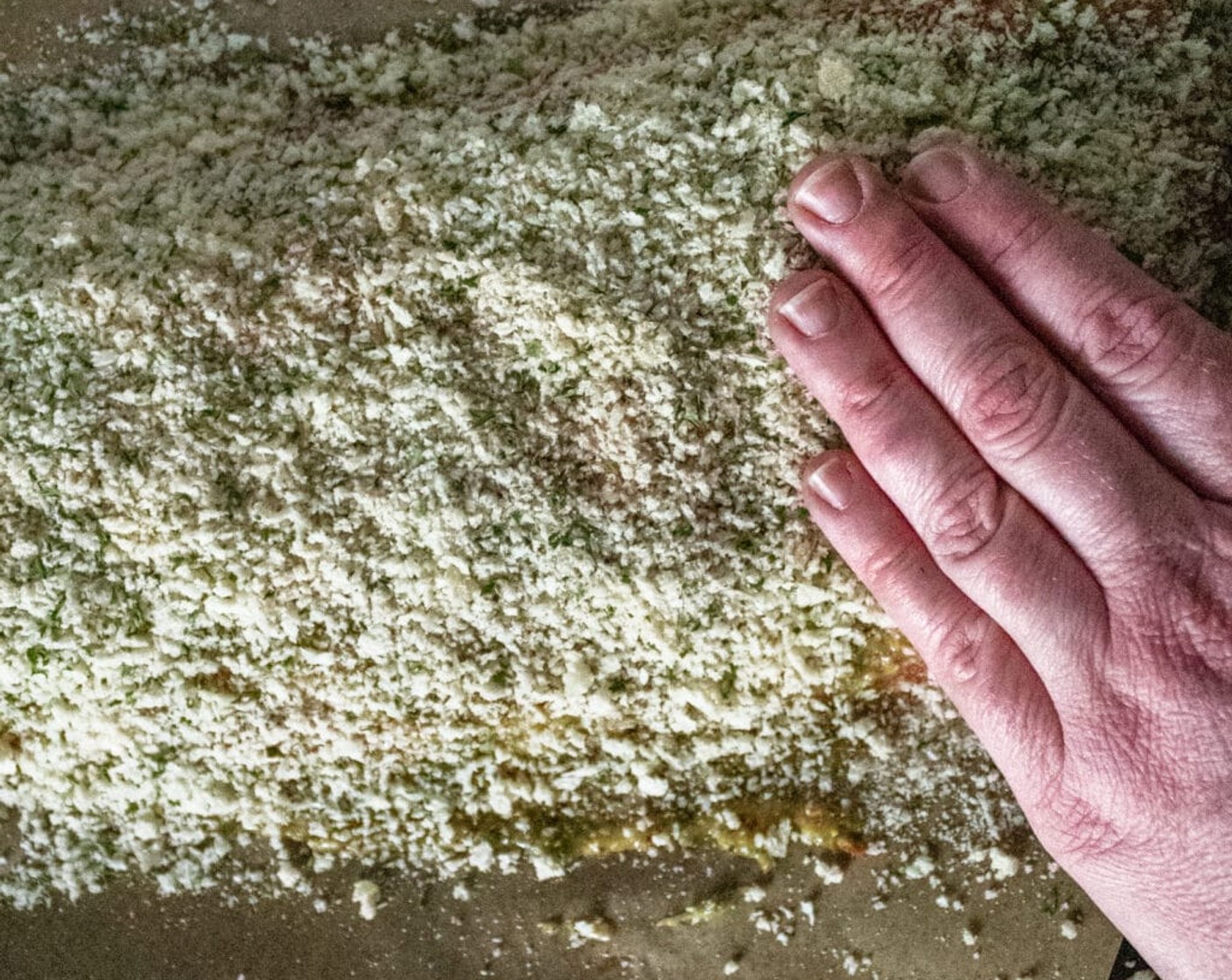 step 5 Pour seasoned breadcrumbs over the entire salmon filet, pressing them slightly into the mustard mixture so it will stick to the salmon.