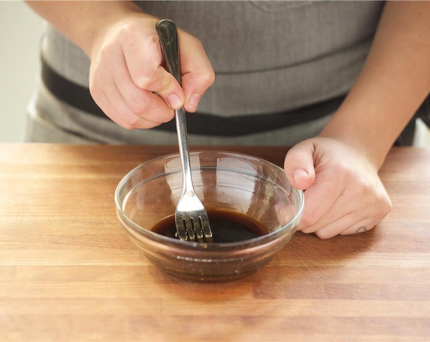 step 3 Juice the remaining Lime (1) into a small bowl and add the Oyster Sauce (1 tsp), Tamari Soy Sauce (1 Tbsp), Brown Sugar (2 Tbsp), and using a fork, whisk until well combined.