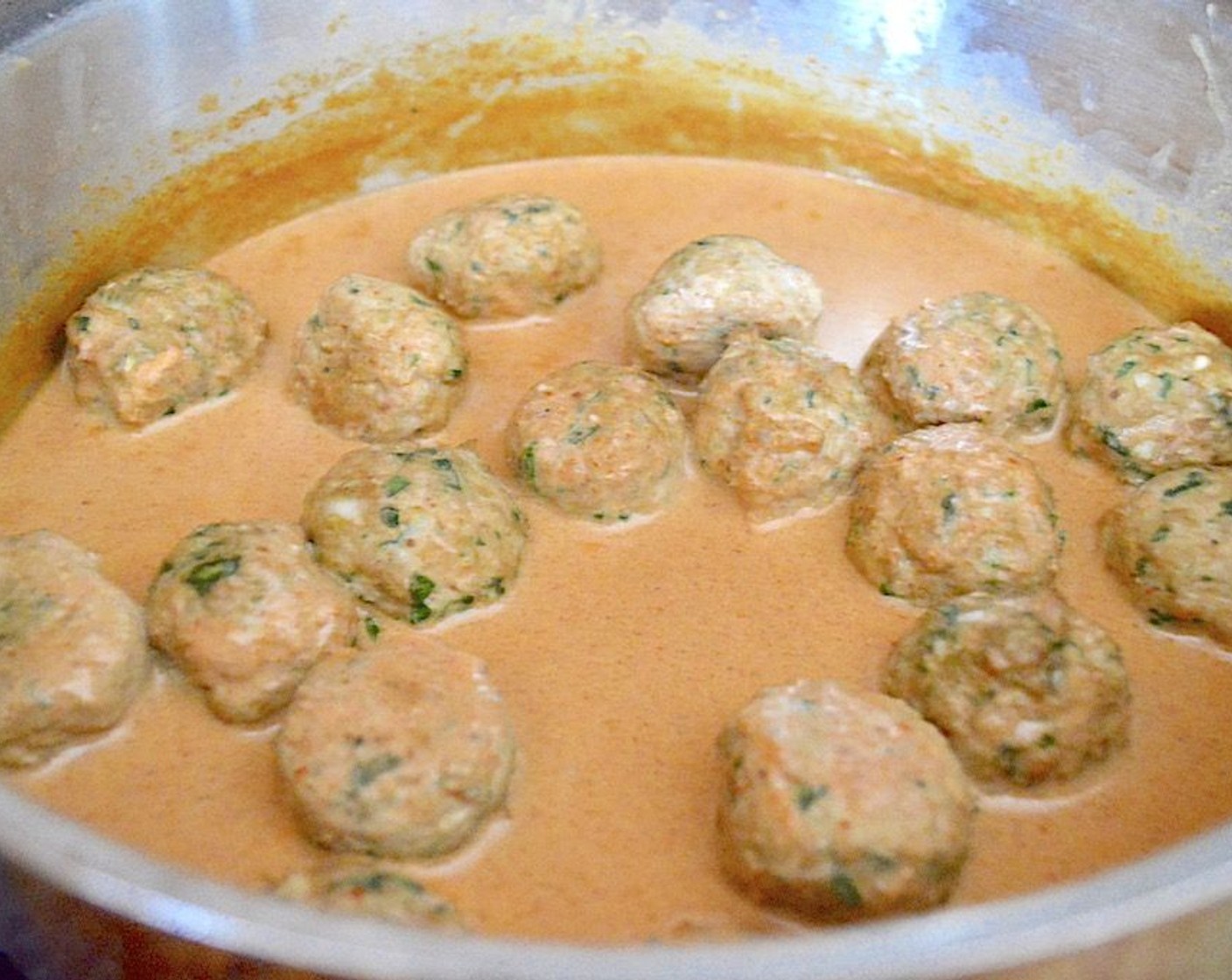 step 6 When the meatballs are done, add them to the sauce. Let the meatballs simmer in the sauce for another 10 minutes.