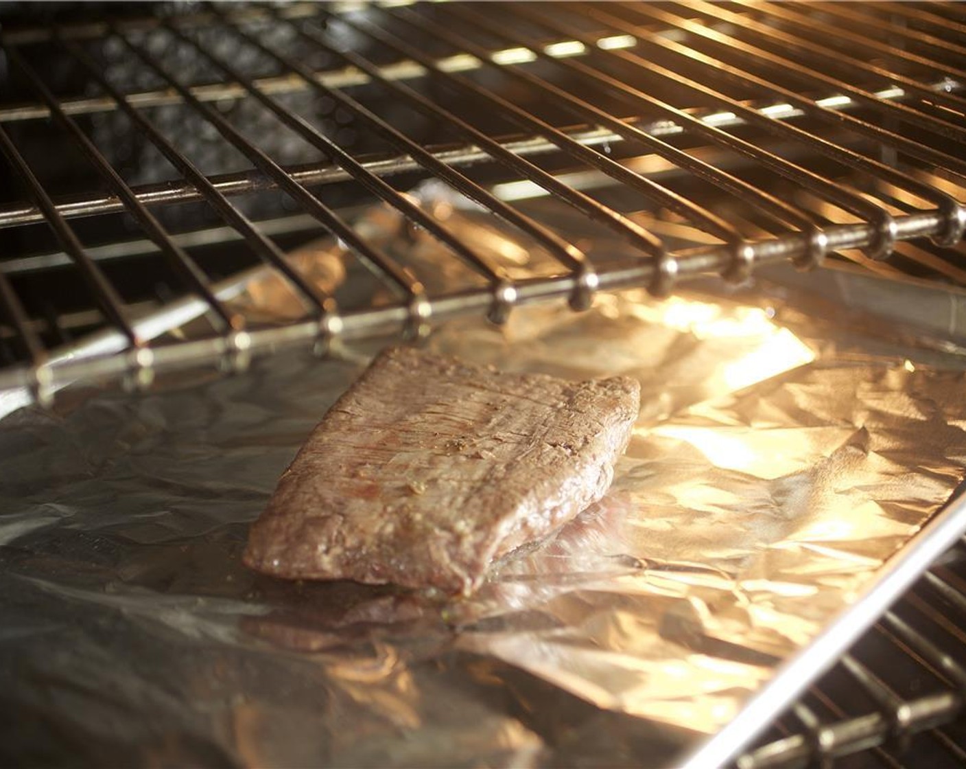 step 10 Pat Flank Steak (8 oz) dry with paper towels. Coat each side with Salt (1/4 tsp) and Ground Black Pepper (1/4 tsp) and Canola Oil (1 tsp). Place on a baking sheet lined with foil.