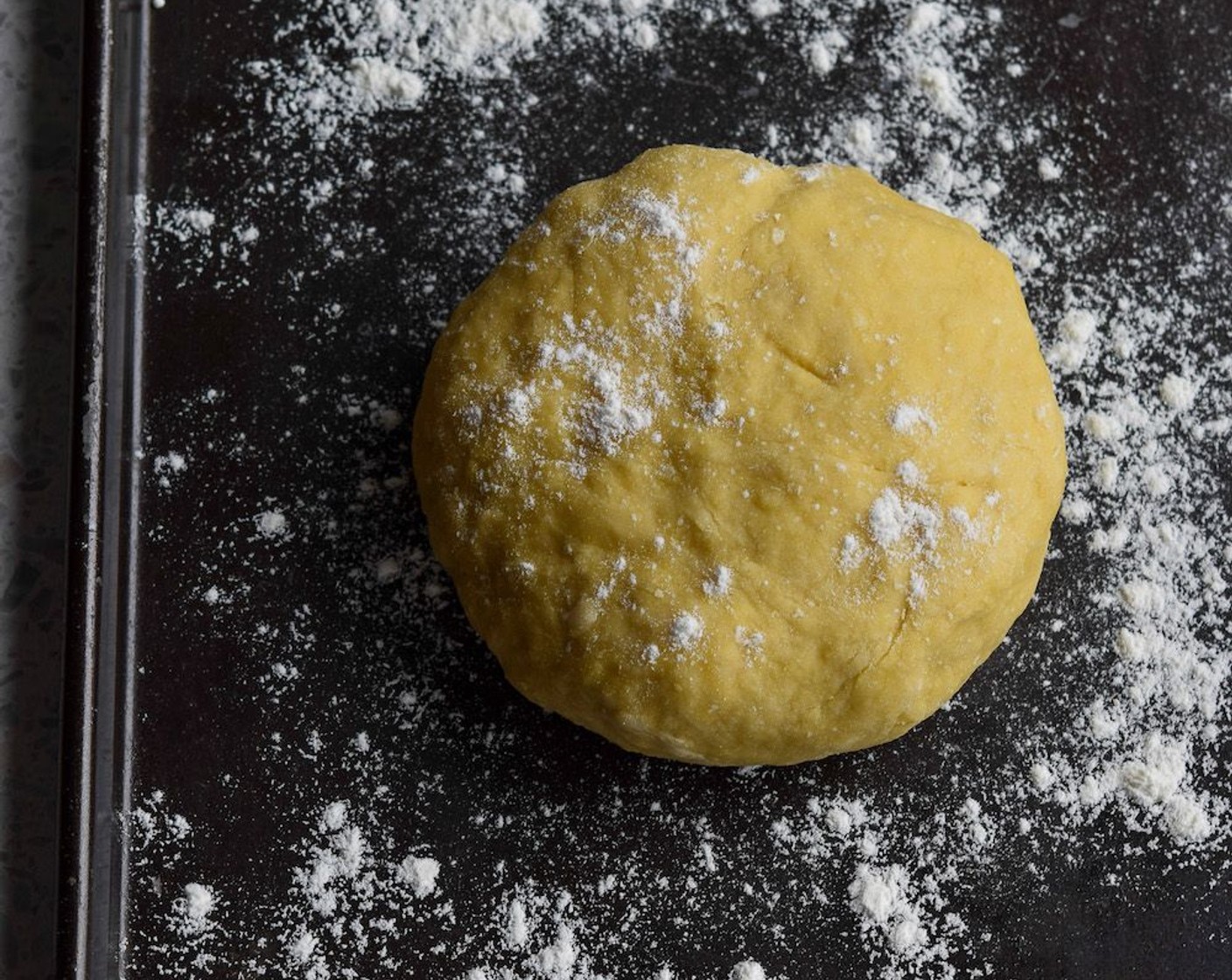 step 6 Dust the work surface with flour and knead the dough until it is smooth and elastic. Wrap the dough in clingfilm and leave to rest for half an hour.