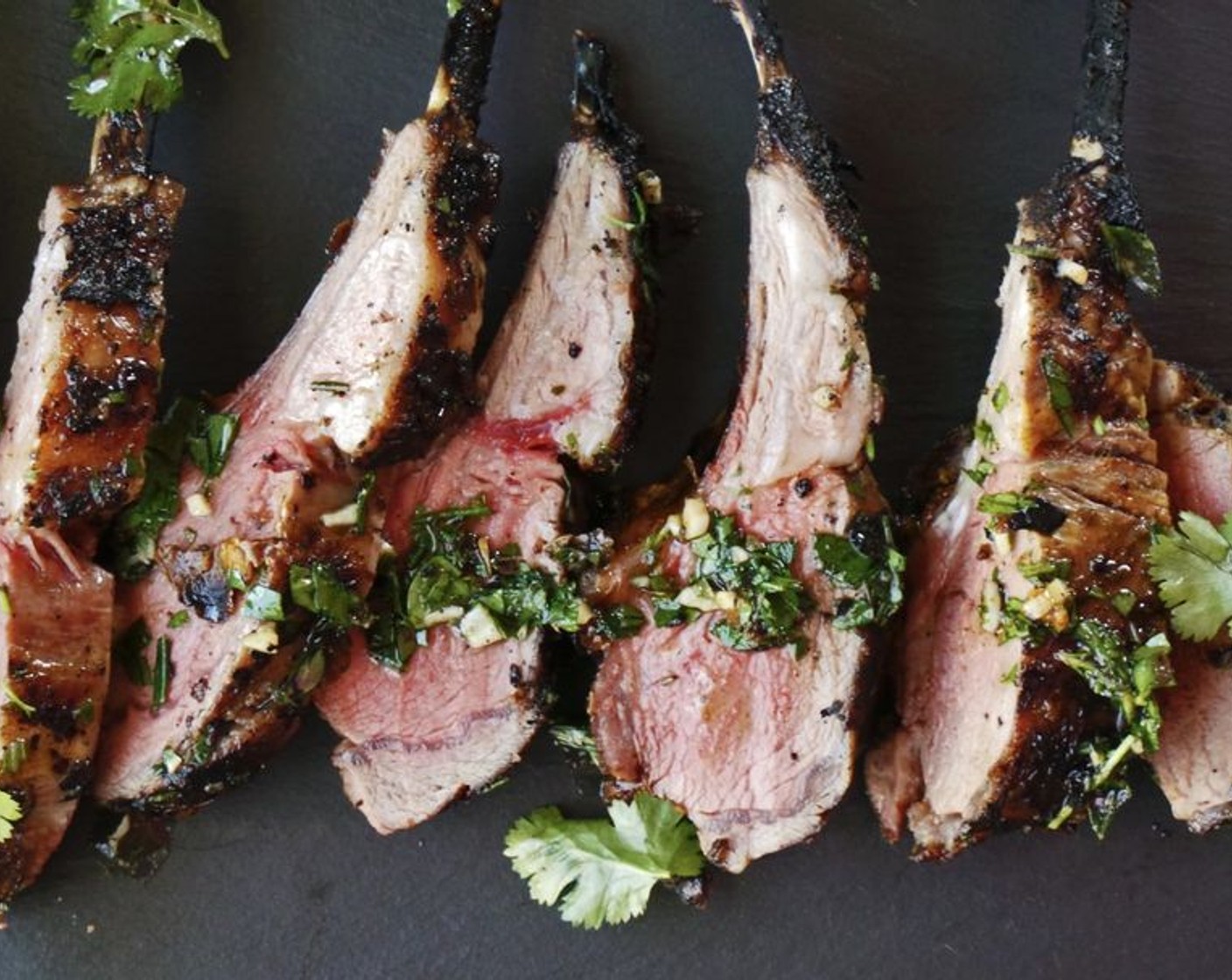 step 7 Immediately transfer to the cutting board with board sauce. Slice between the rib bones to make chops. Use the board sauce and the juices from the lamb as a serving sauce.