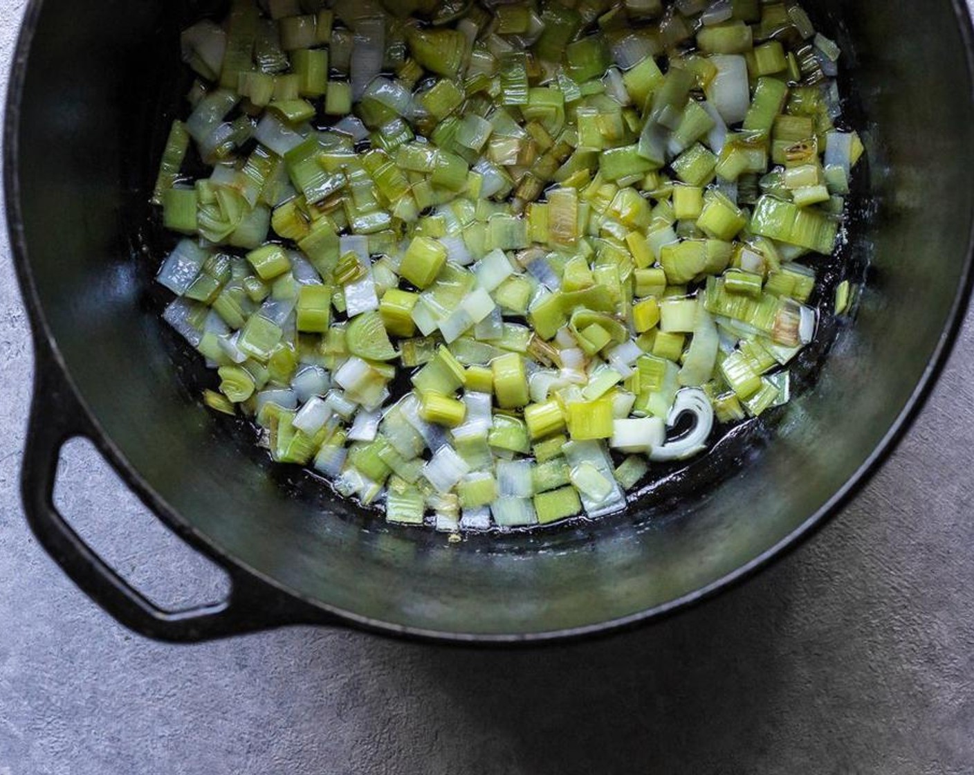 step 4 In a medium pot, melt 3 tablespoon of Butter (3 Tbsp) over low heat and add the sliced leeks to the melted butter. Stir to coat the leeks in butter and simmer over low heat for about 20 minutes, stirring often until leeks are soft and tender without browning.