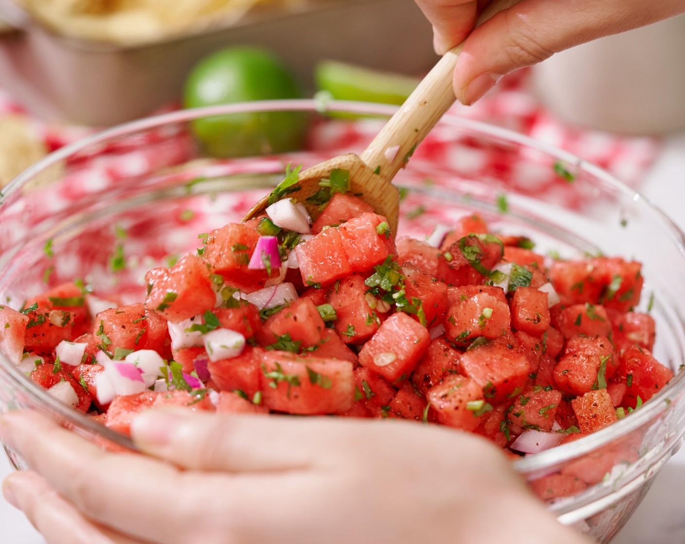 step 2 In a large bowl, add the watermelon cubes, Red Onion (1/4), Jalapeño Peppers (2), Fresh Cilantro (1 bunch), Fresh Mint (1 stalk), Lime (1), and Tajin (3/4 tsp). Use a spatula to gently mix until well combined. Optionally, leave the salsa in the fridge for at least 15 minutes.