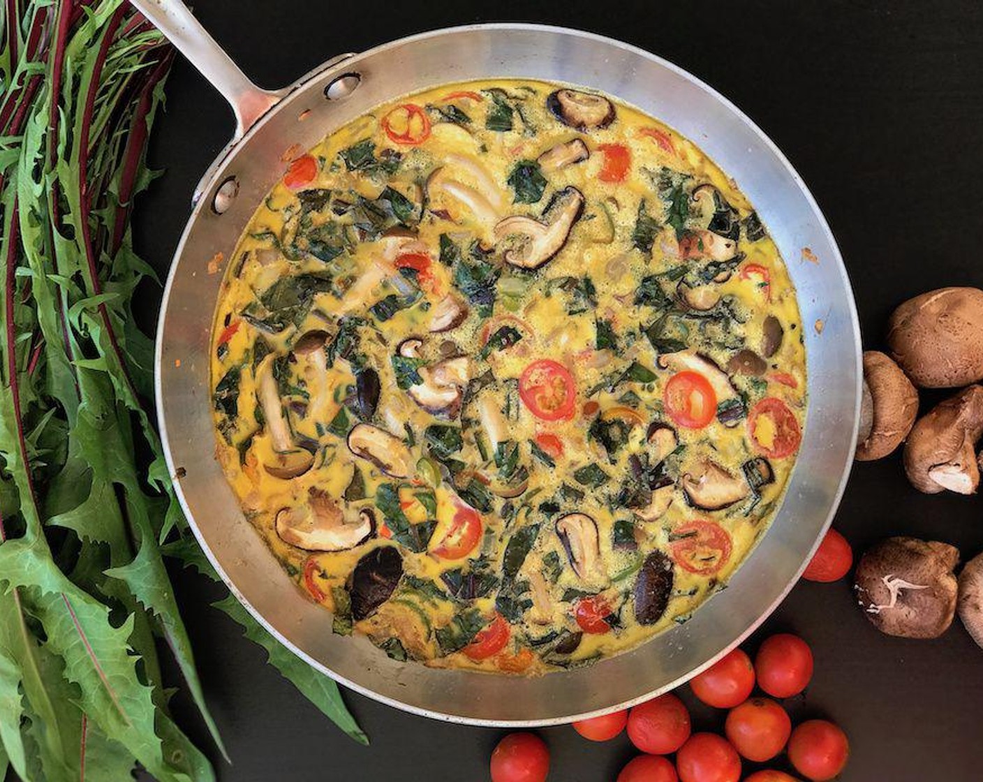 Frittata with Dandelion Greens, Cherry Tomatoes, Mushrooms and Serrano Pepper