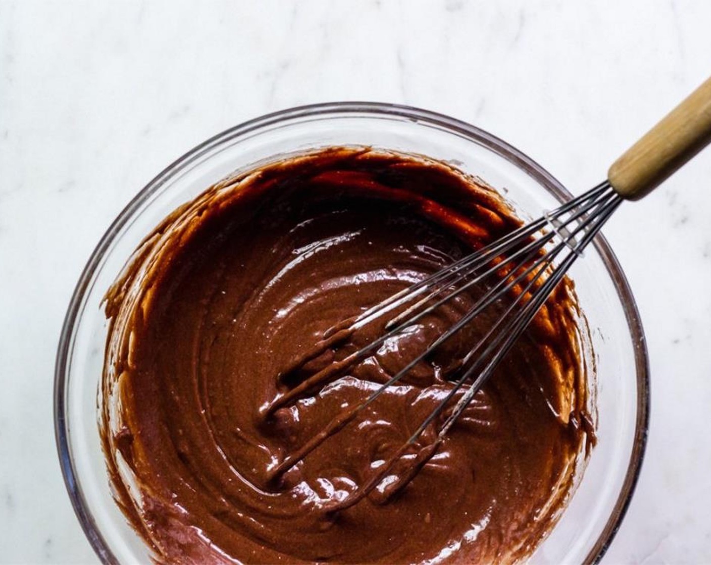 step 4 In a medium saucepan, melt Unsalted Butter (1/3 cup) over medium heat. Turn heat to low, add Semi-Sweet Baking Chocolate (1 cup) and stir until just melted. Remove from heat and whisk in the Granulated Sugar (1/2 cup).