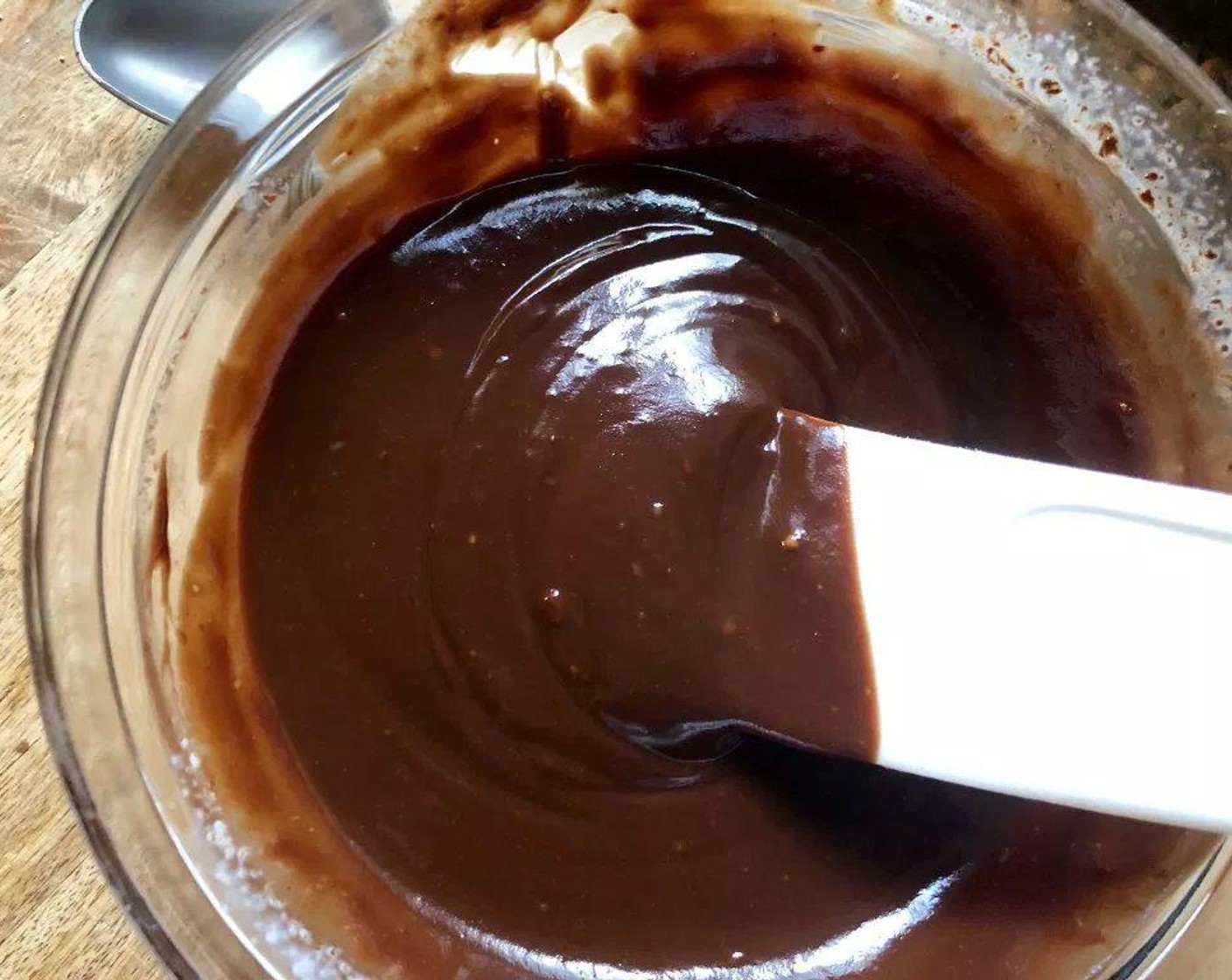 step 9 Bring Whipping Cream (1/3 cup) to boil in a small heavy saucepan. Pour the heated cream over the chocolate mixture; stir continuously until the mixture is melted and smooth.