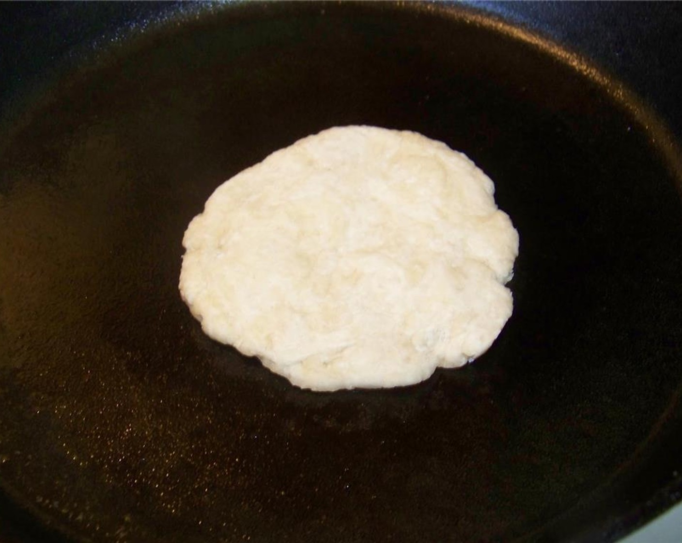 step 5 To cook the roti, heat a heavy-duty skillet or cast-iron skillet on medium-high heat. Once hot, cook on both sides until you get them well browned.