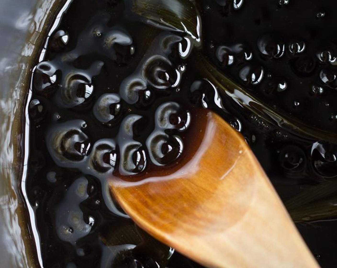 step 5 Drain the boba from the cooking water and add them back to the saucepan with a quarter cup of water and about half a cup of the pandan sugar syrup.