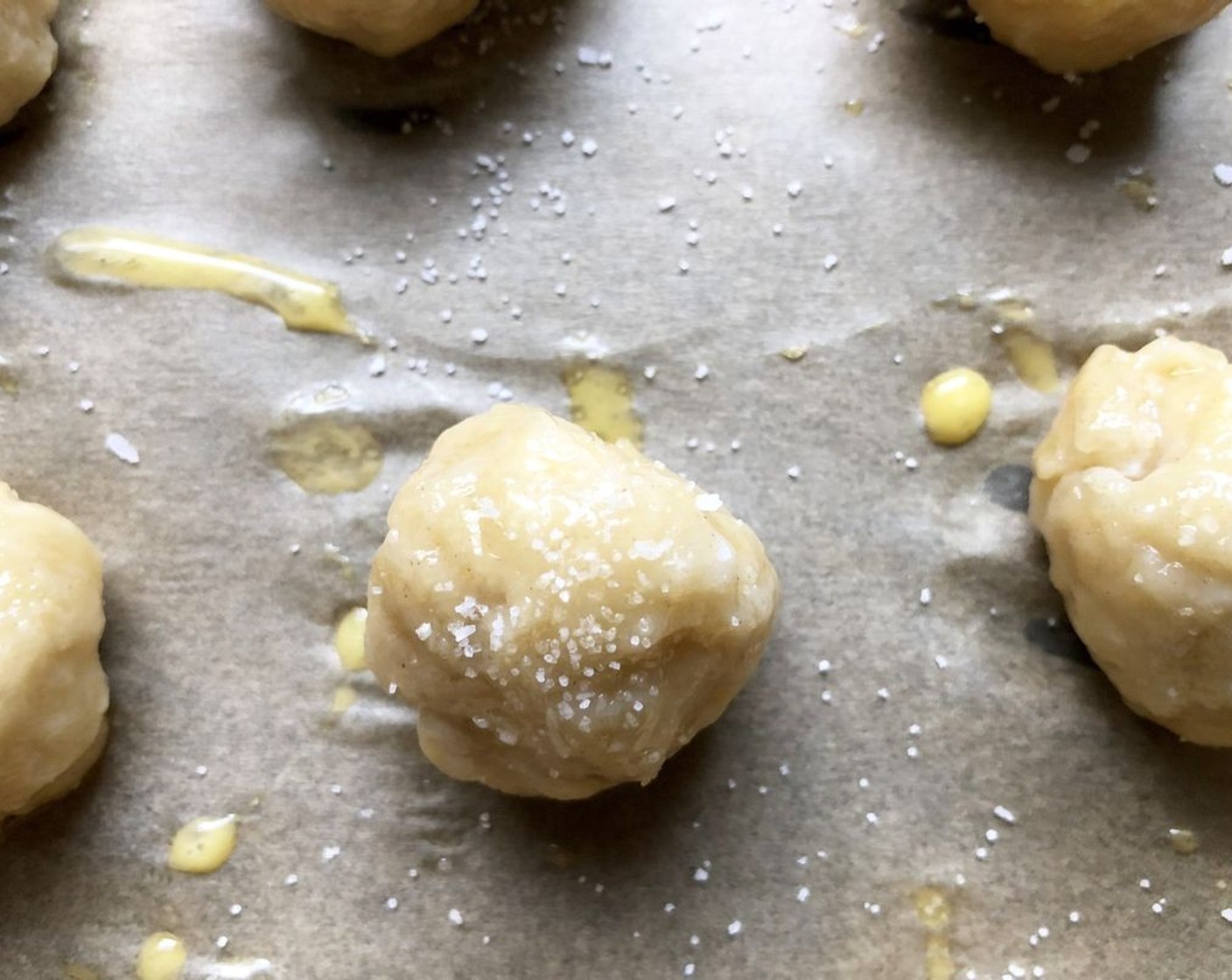 step 5 Beat the Farmhouse Eggs® Large Brown Egg (1) and brush the tops with it, then sprinkle with the Coarse Salt (to taste). Bake for 12 to 15 minutes or until golden.